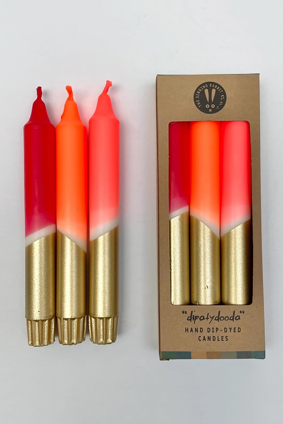 The Singing Rabbit Red, Neon Coral, Neon Orange & Gold Dip Dyed Dinner Candles Set Of 3