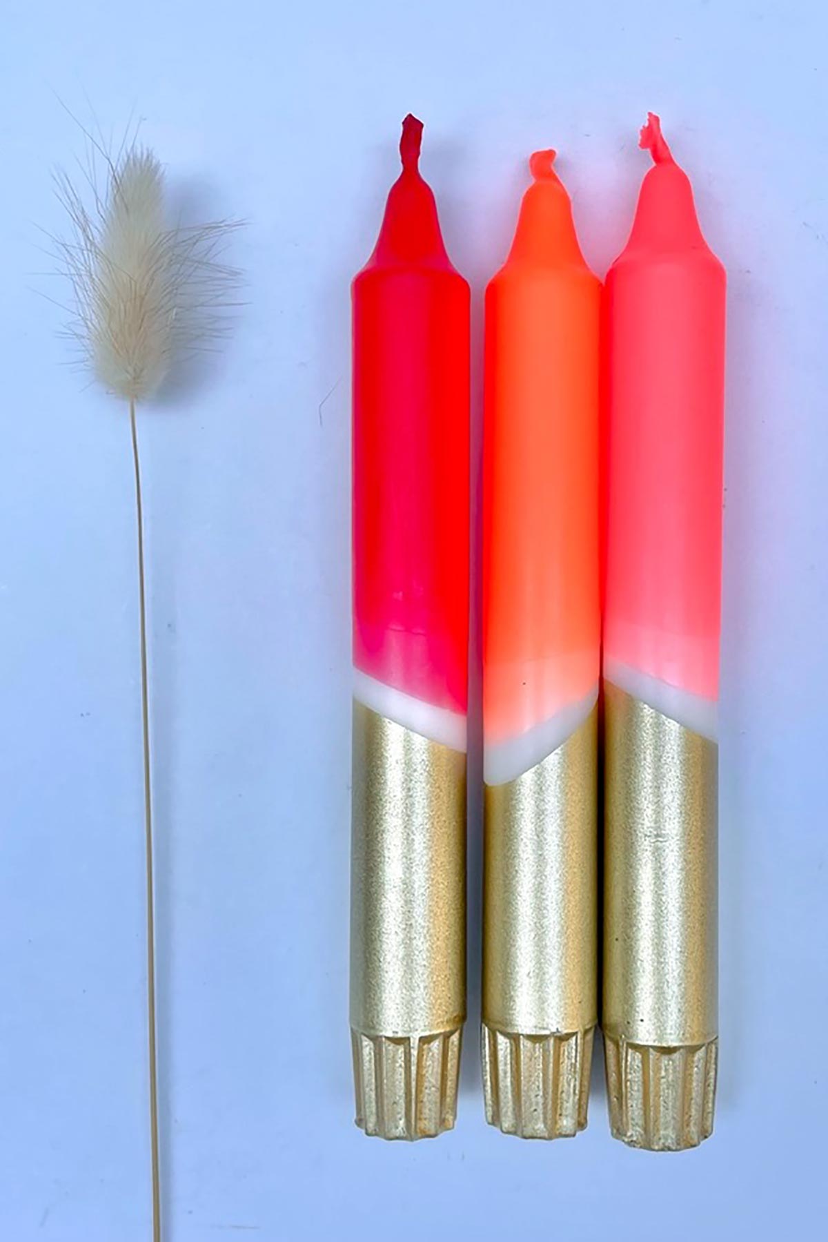 The Singing Rabbit Red, Neon Coral, Neon Orange & Gold Dip Dyed Dinner Candles Set Of 3