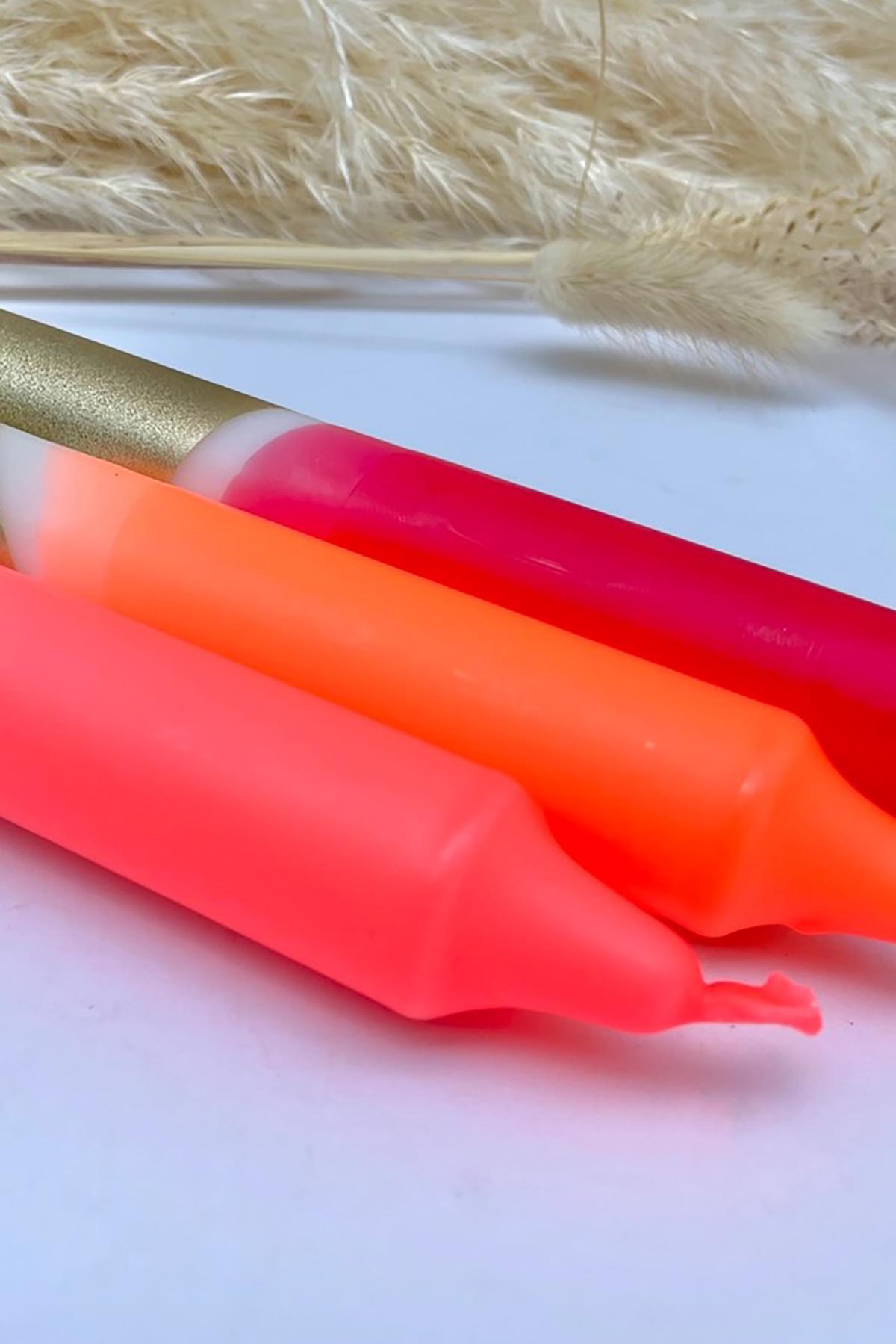 The Singing Rabbit Red, Neon Coral, Neon Orange & Gold Dip Dyed Dinner Candles Set Of 3