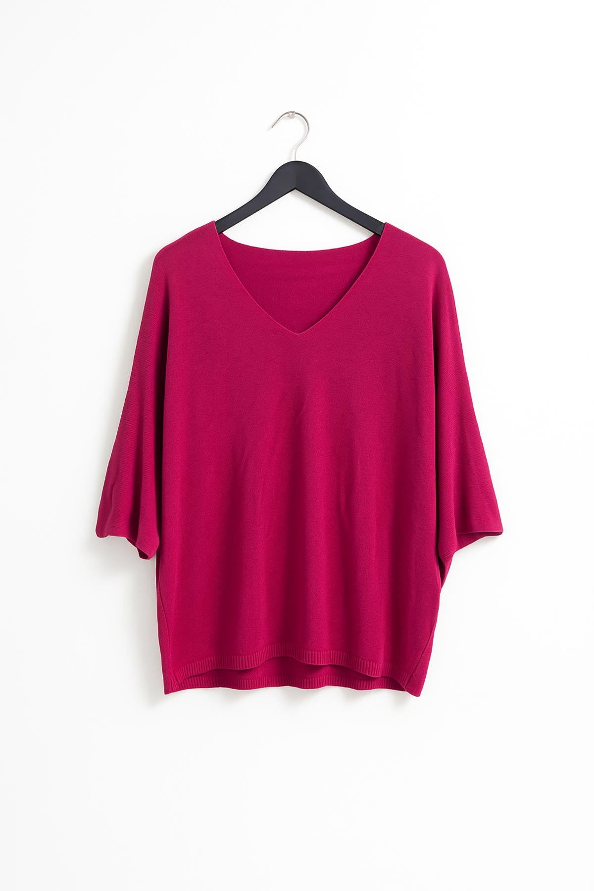Close-up of Aria knit top in fuchsia showing fine lightweight texture