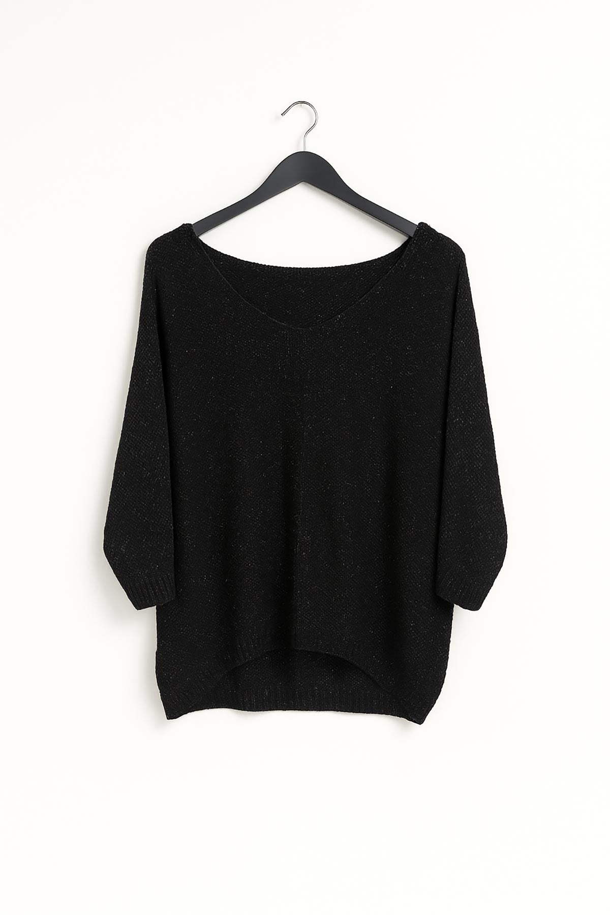 Close-up of Aurora knit top in black showing lurex shimmer and soft knit texture