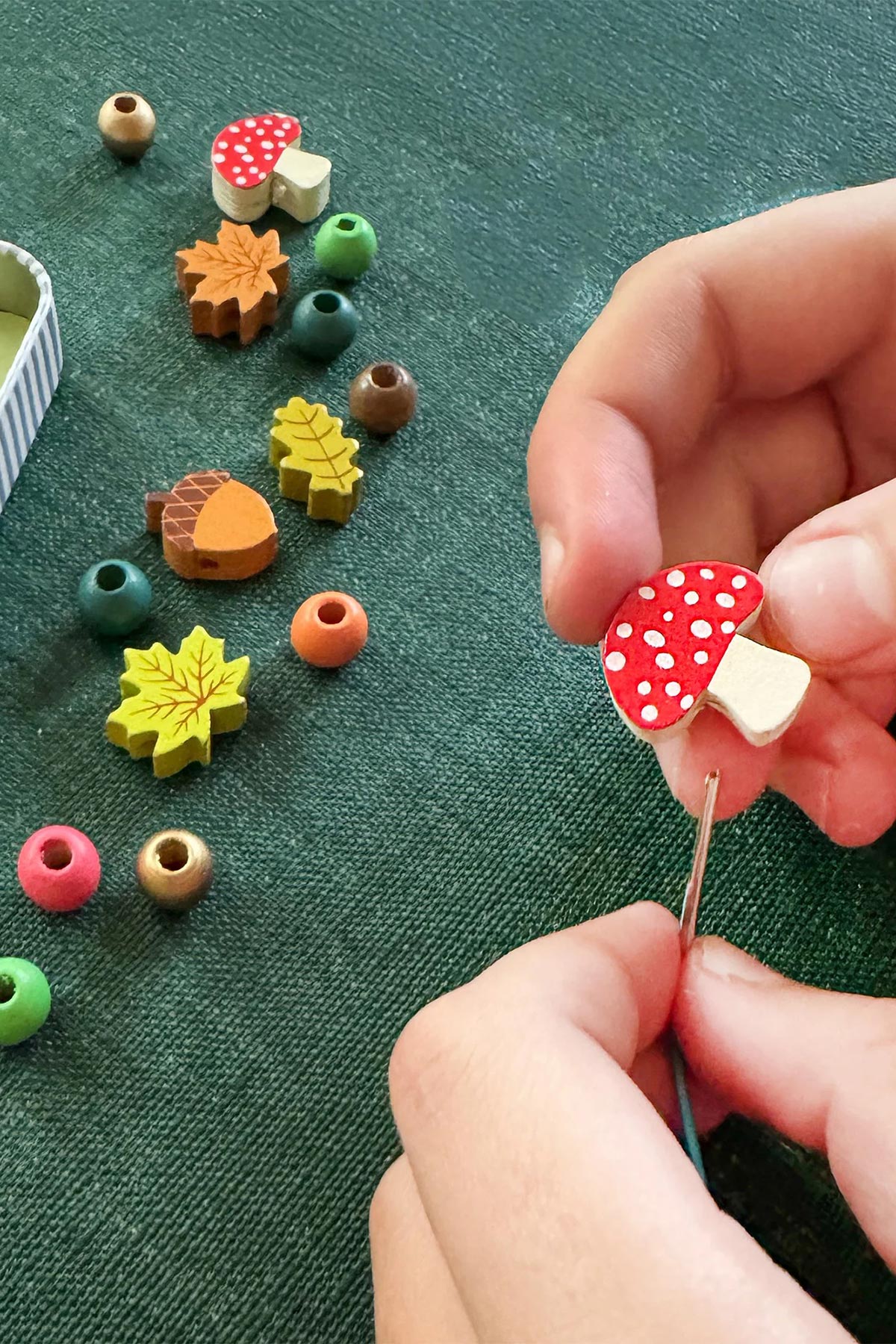 Child crafting forest-themed bracelet