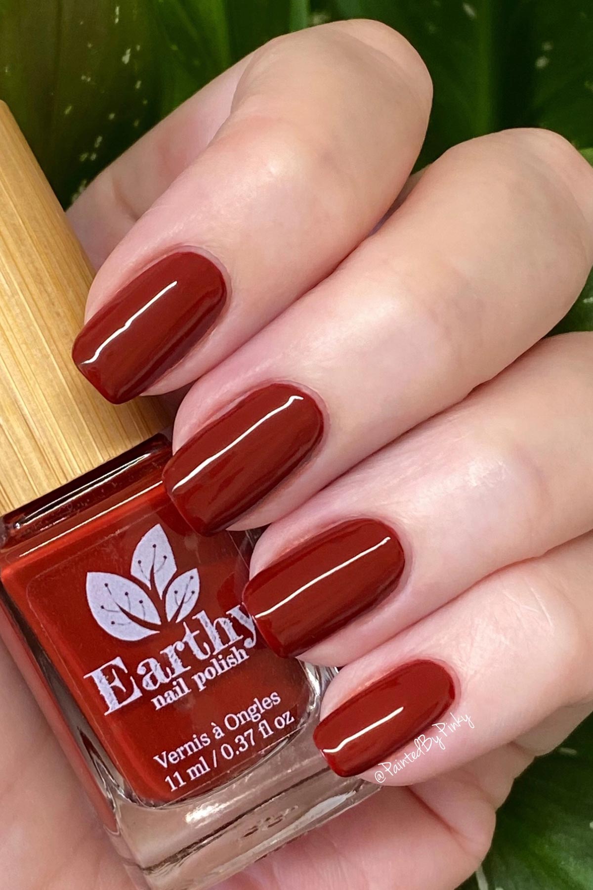 Earthy Ruby Red Nail Polish swatch deep rich red lifestyle