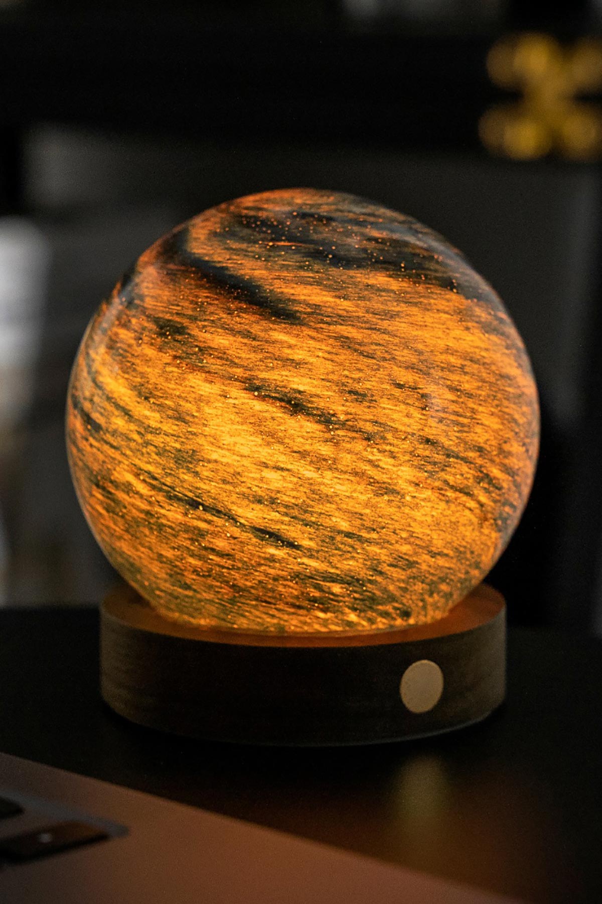 Illuminated orange Stellar Ocean LED glass orb