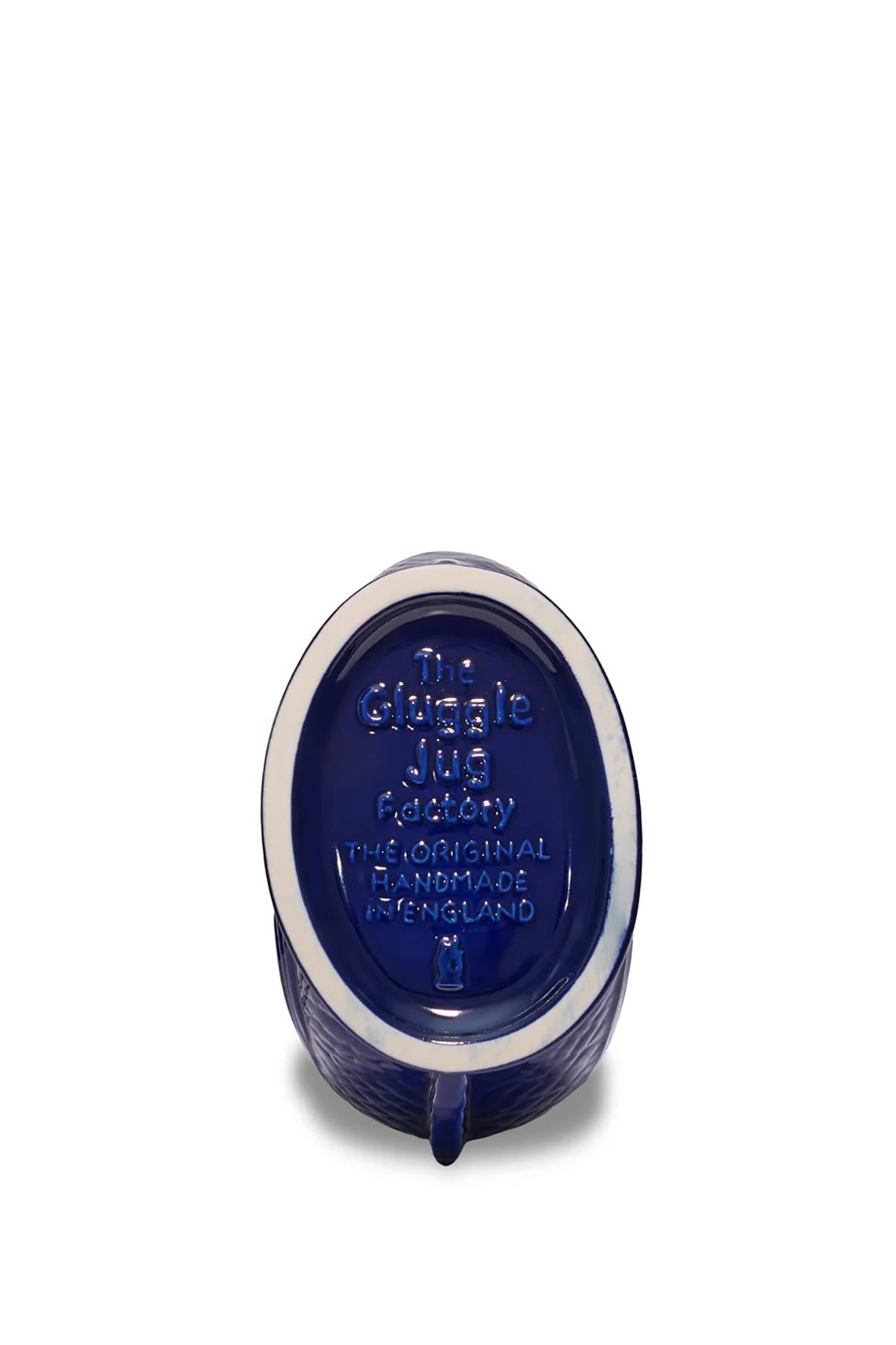Cobalt blue Gluggle Jug styled as a decorative vase in a home setting