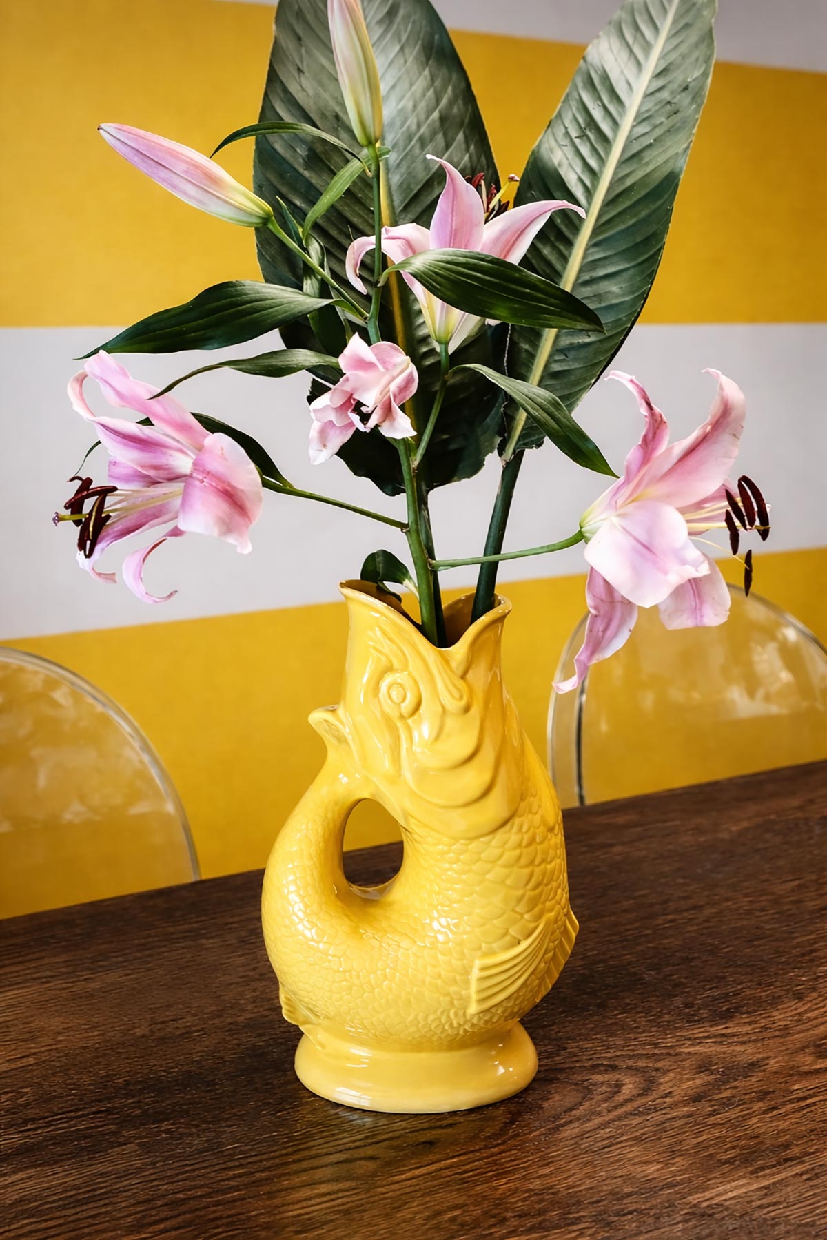 Yellow Gluggle Jug styled as a decorative vase in a bright home setting