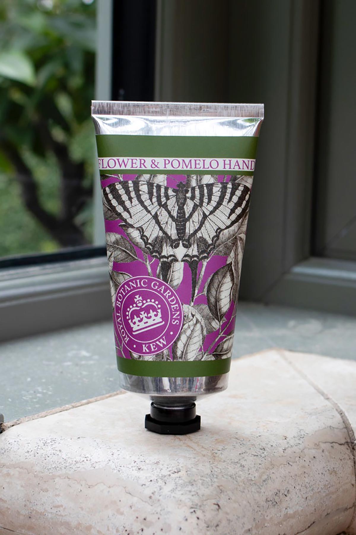 Close-up detail of Kew Gardens Elderflower and Pomelo Hand Cream floral tube design
