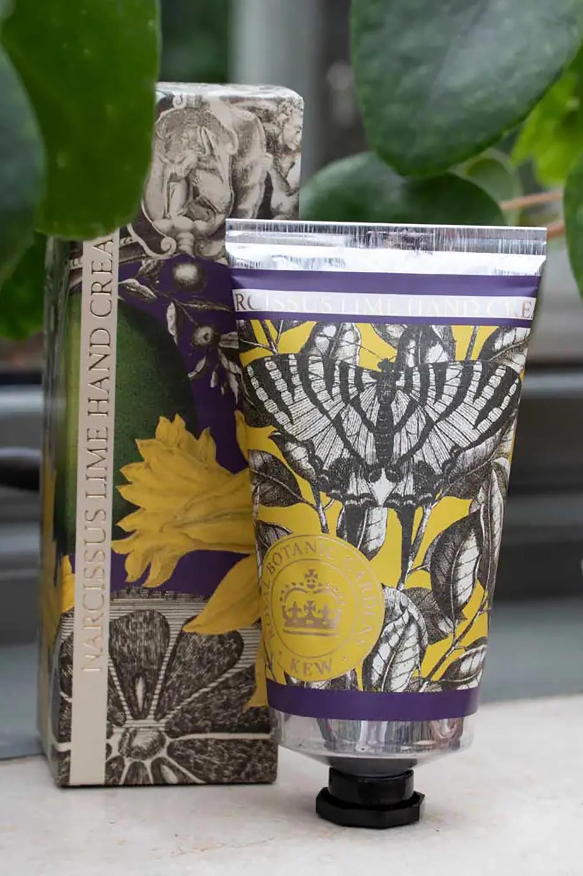 Close-up detail of Kew Gardens Narcissus Lime Hand Cream floral tube design