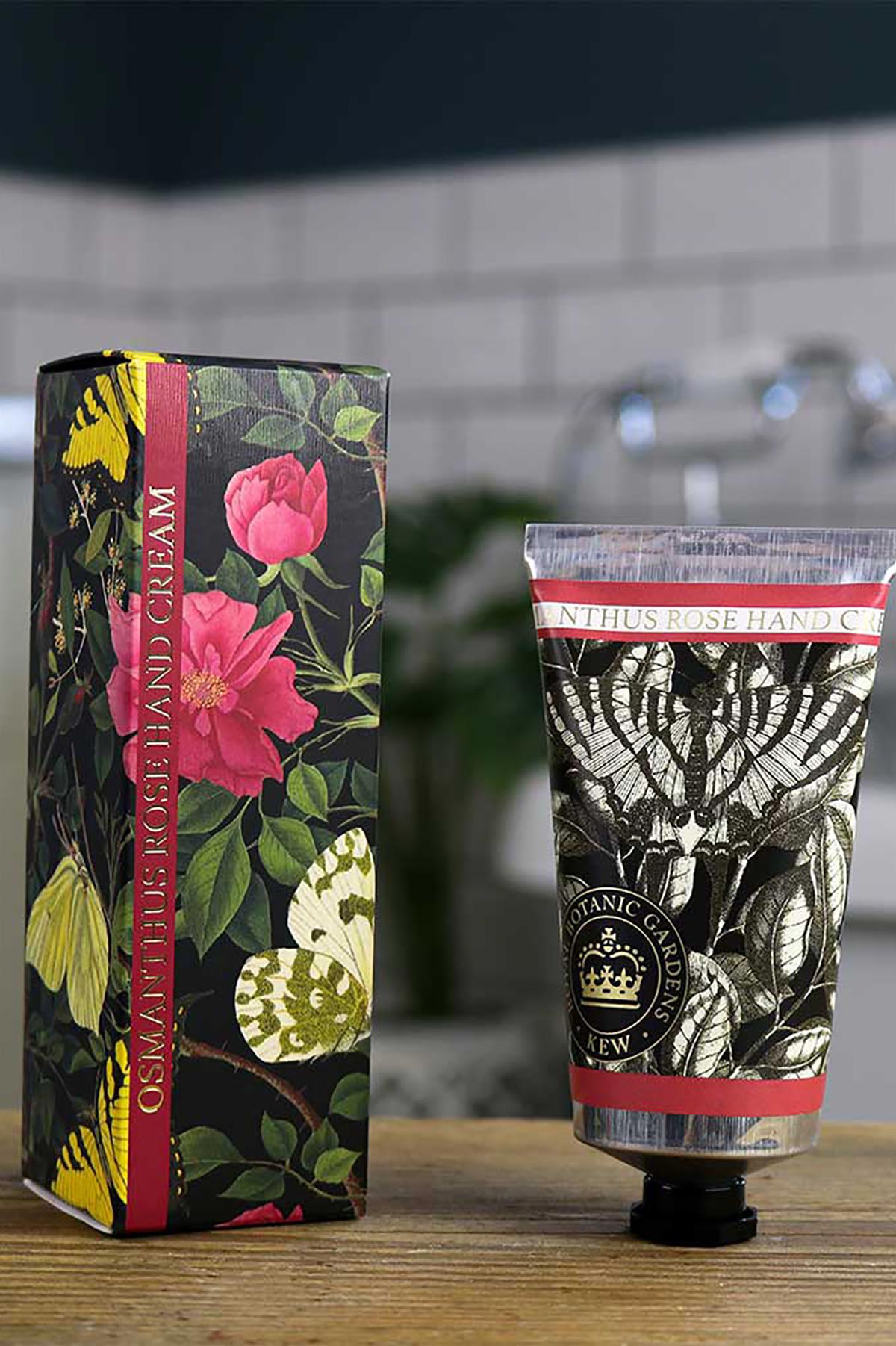 Close-up detail of Kew Gardens Osmanthus Rose Hand Cream floral tube design