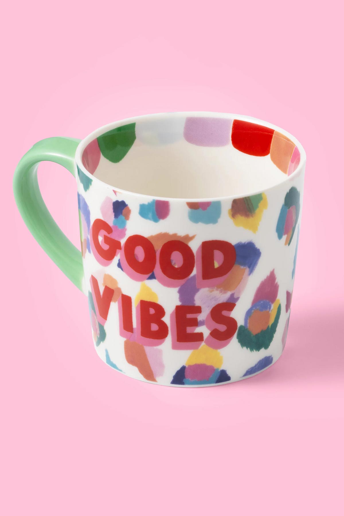Detail of hand-painted leopard print on ceramic mug