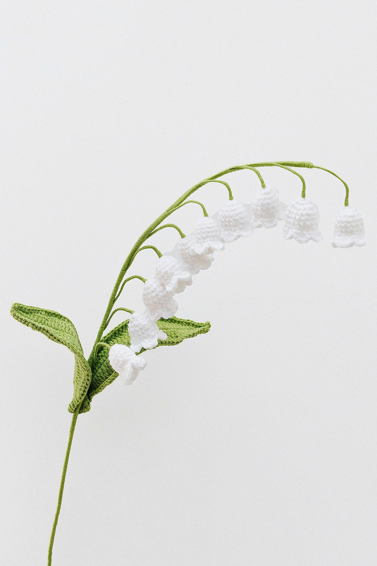 White lily of the valley crochet flower stem handmade in cotton yarn, styled for soft natural home décor at Urban Wild
