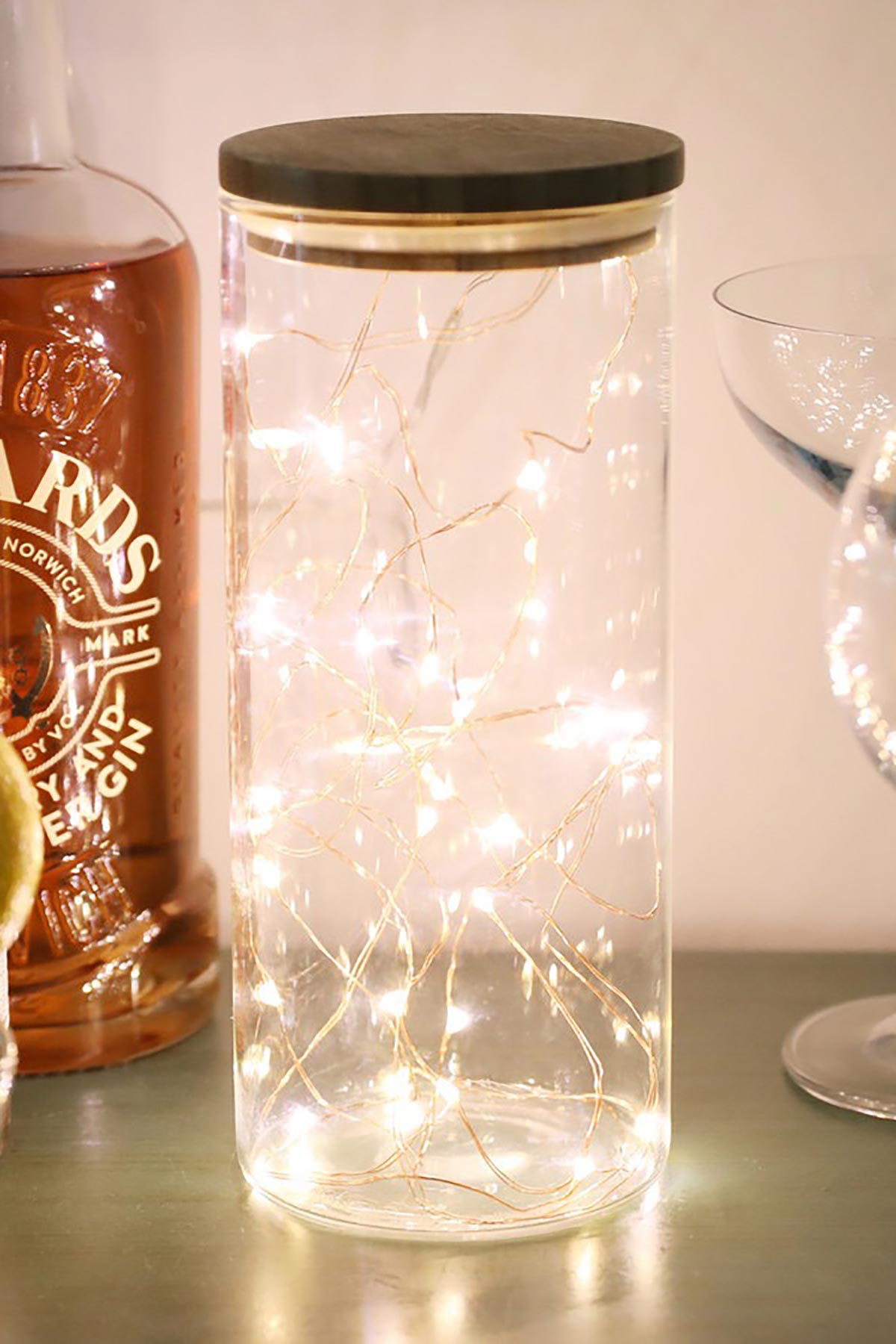 Lisa Angel Copper Wire String Lights arranged around décor jar