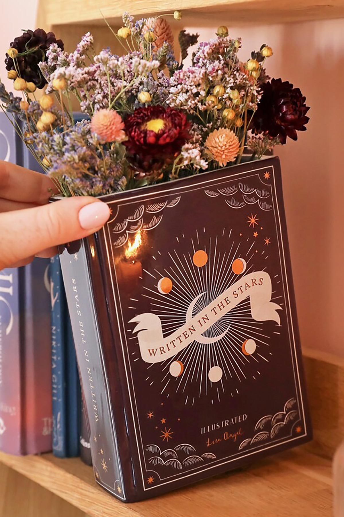 Purple book-shaped vase with celestial illustrations by Lisa Angel