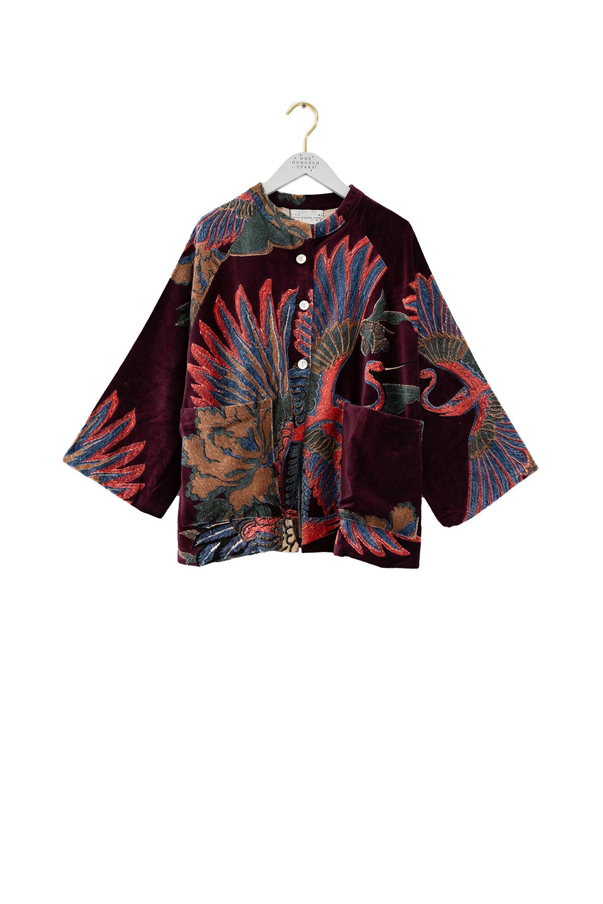 Close-up botanical crane print on velvet jacket