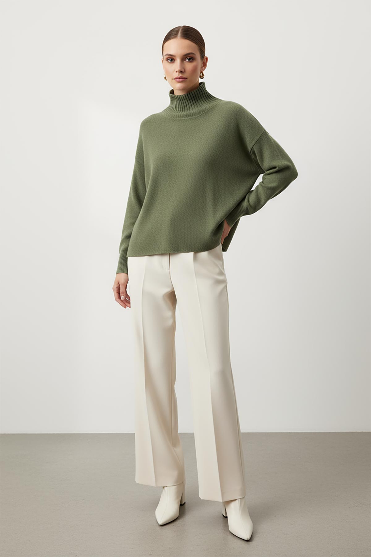 Olive Haze Seamless Turtleneck Jumper styled with trousers – oversized fit