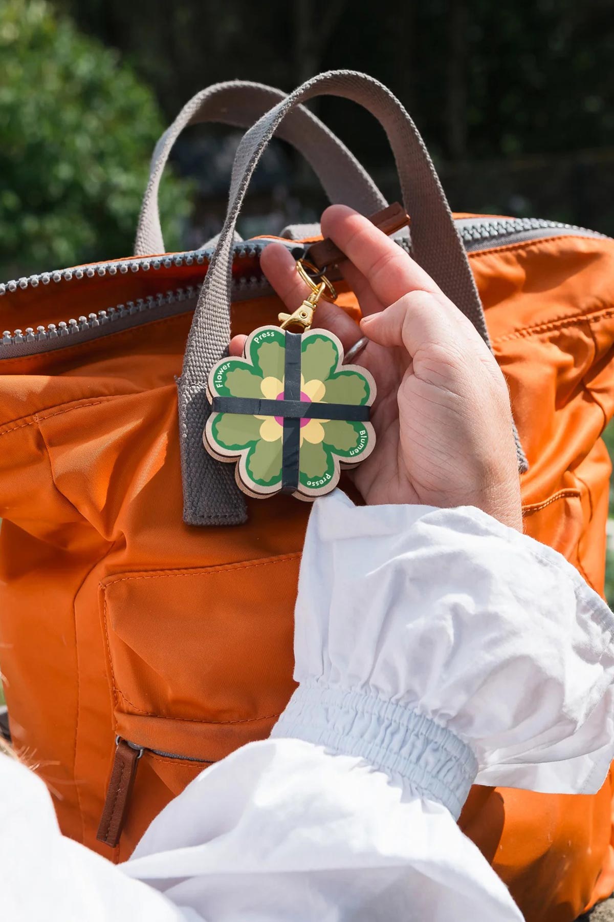 Open keyring flower press showing internal layers lifestyle
