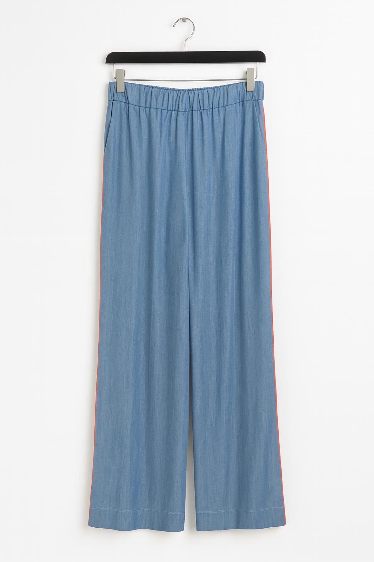 Close-up of Sunline Tencel Wide Leg Pants showing orange side piping detail