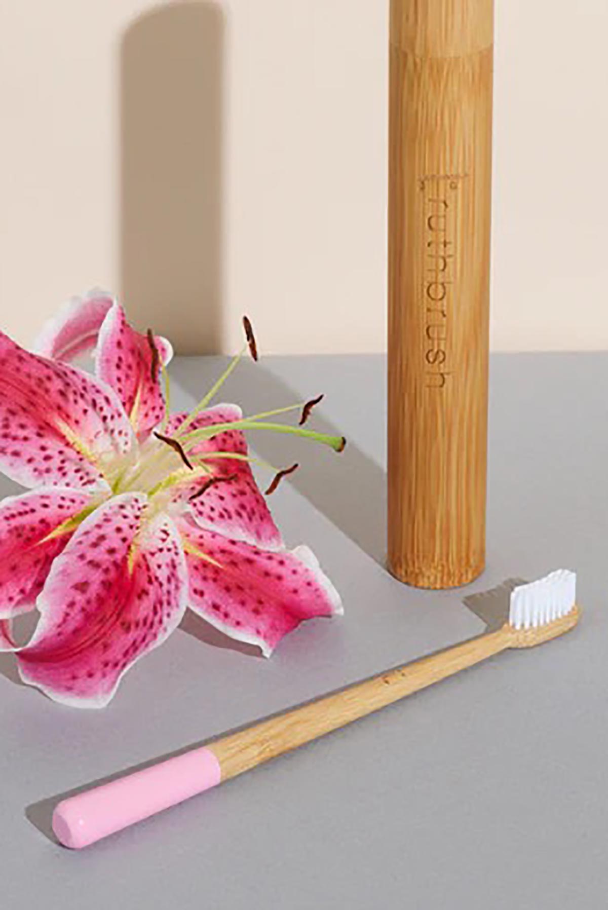 Pink bamboo toothbrush by Truthbrush