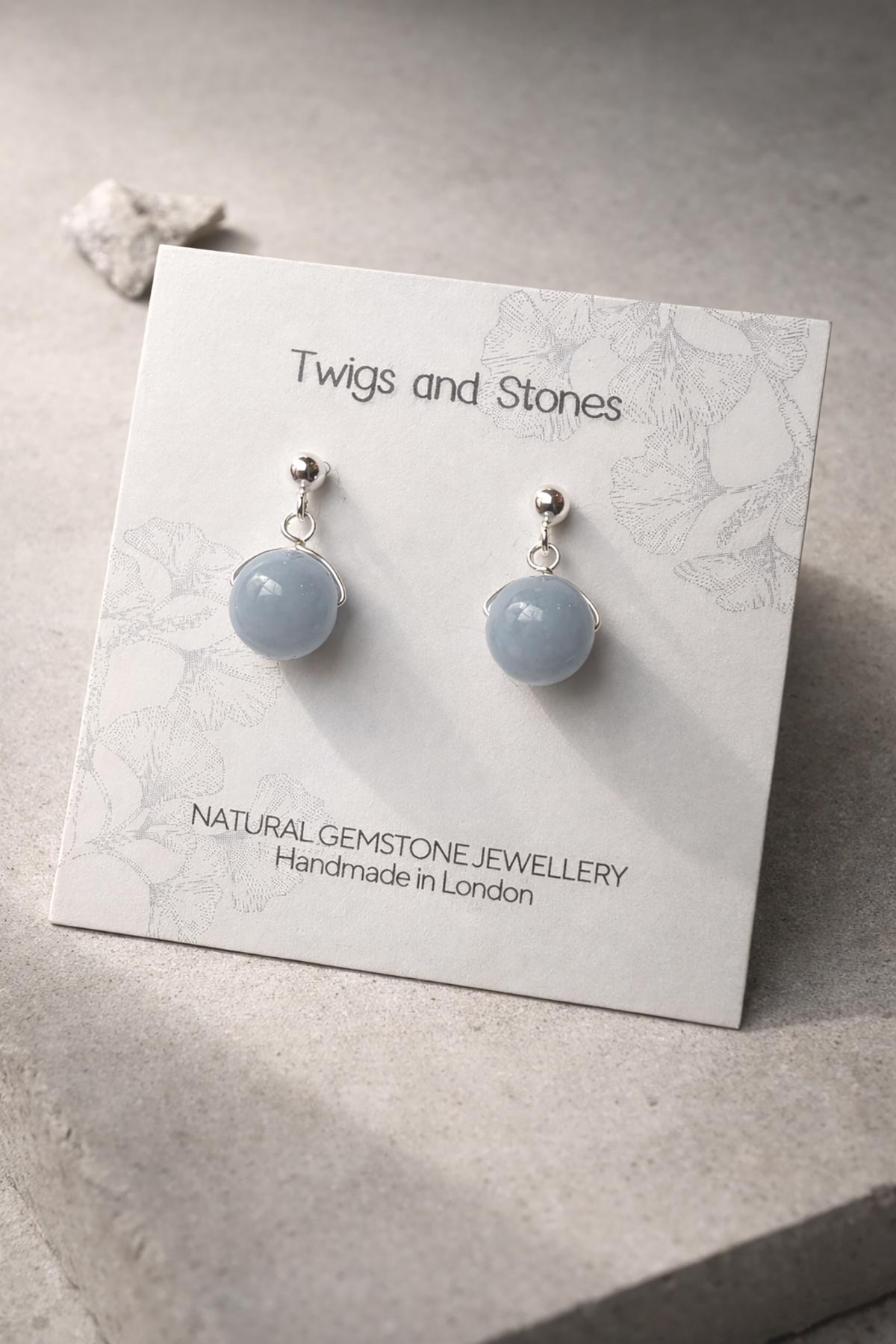 Close-up of angelite gemstone stud earring
