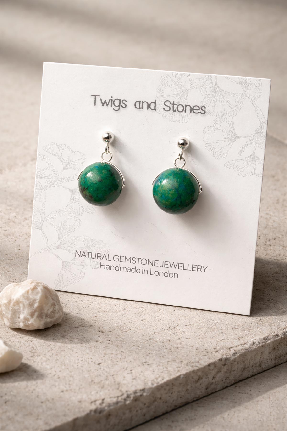 Close-up of chrysocolla gemstone stud earrings