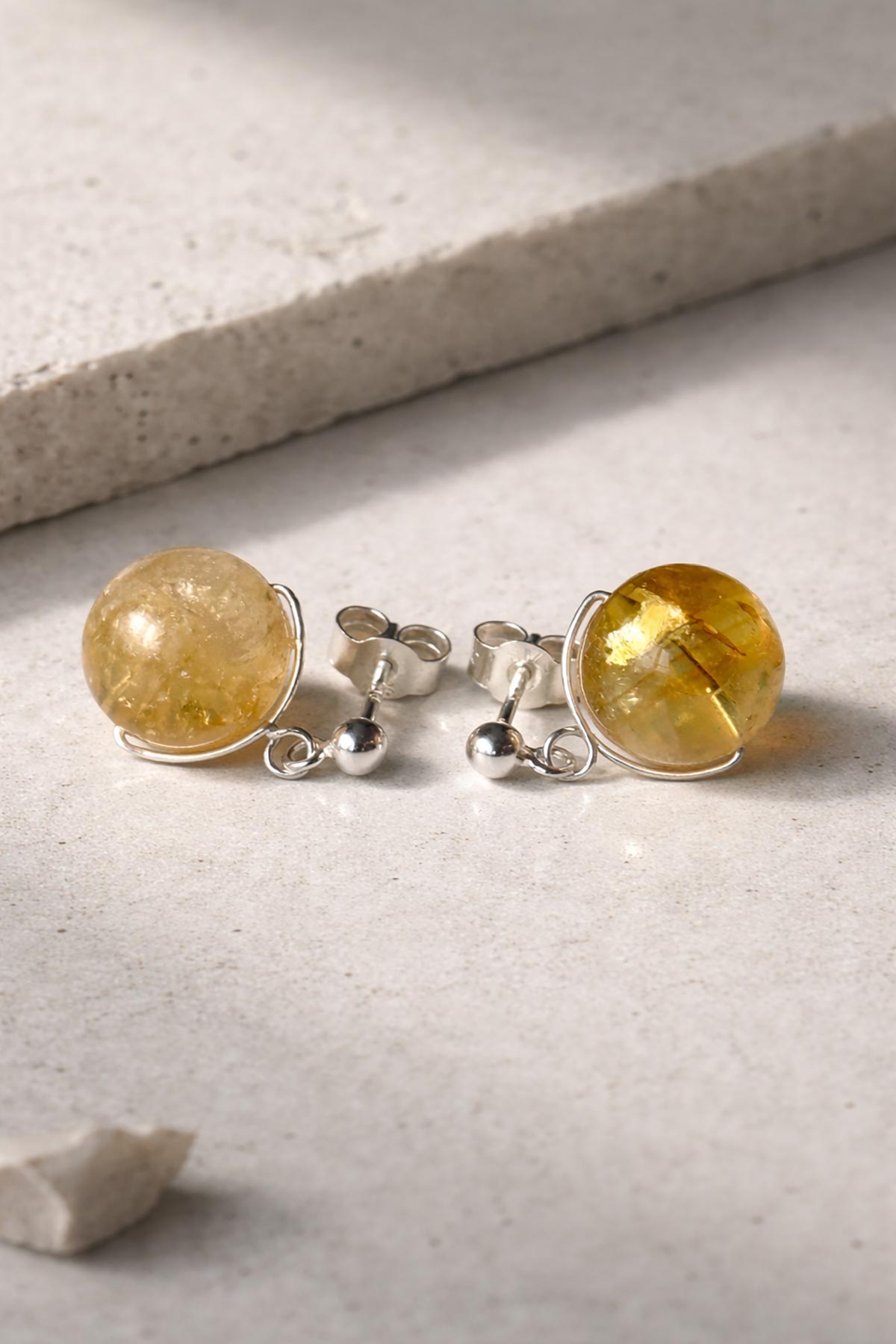 Close-up of citrine gemstone stud earrings