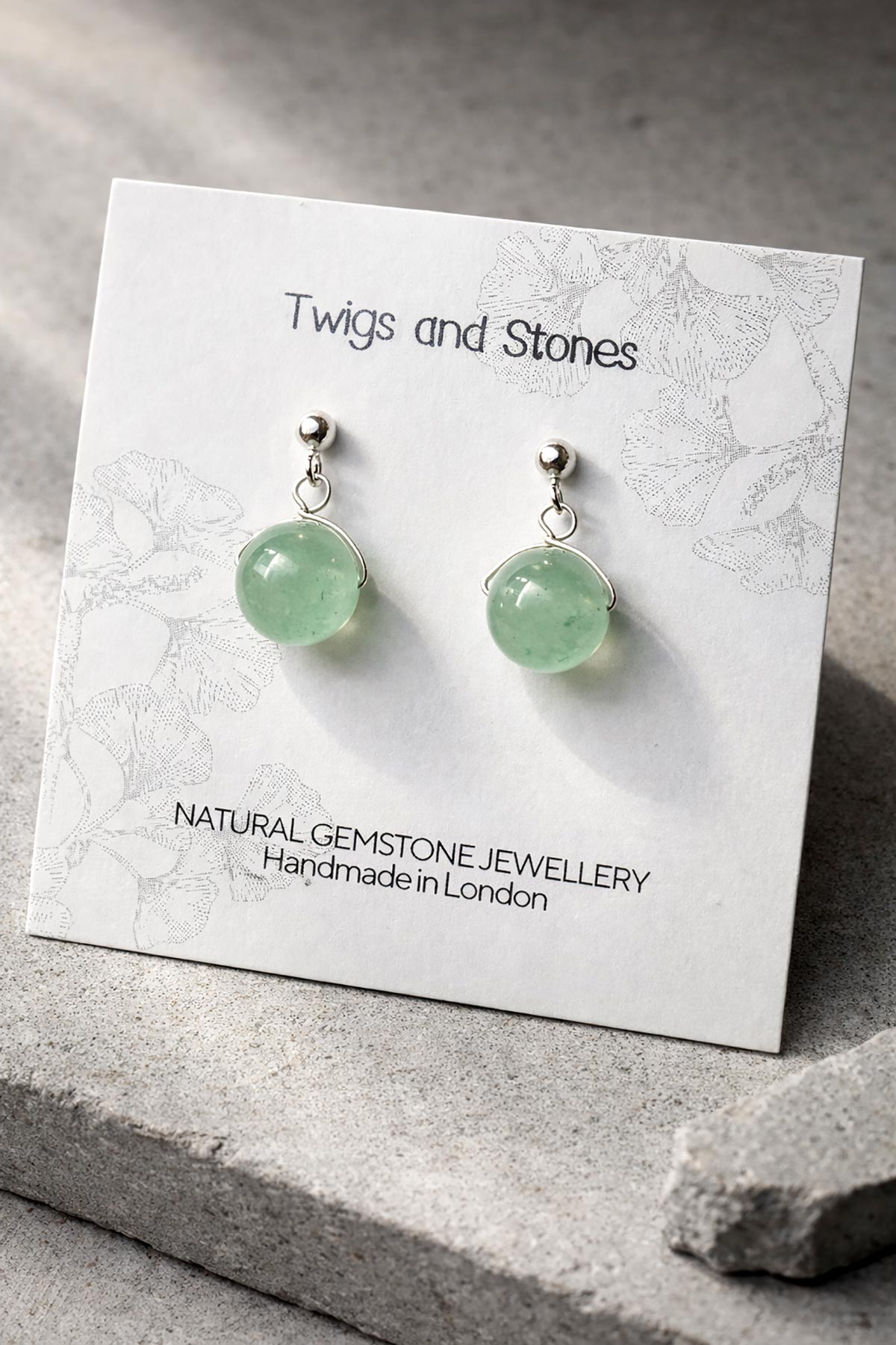 Close-up of green aventurine gemstone stud earrings