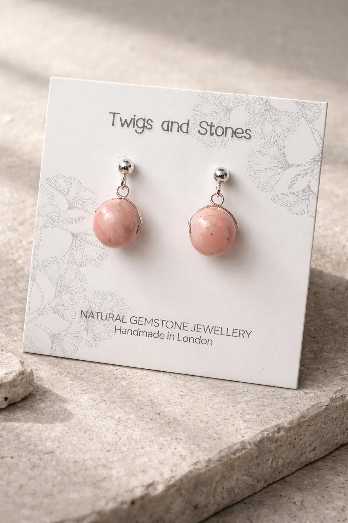 Close-up of rhodochrosite gemstone stud earrings