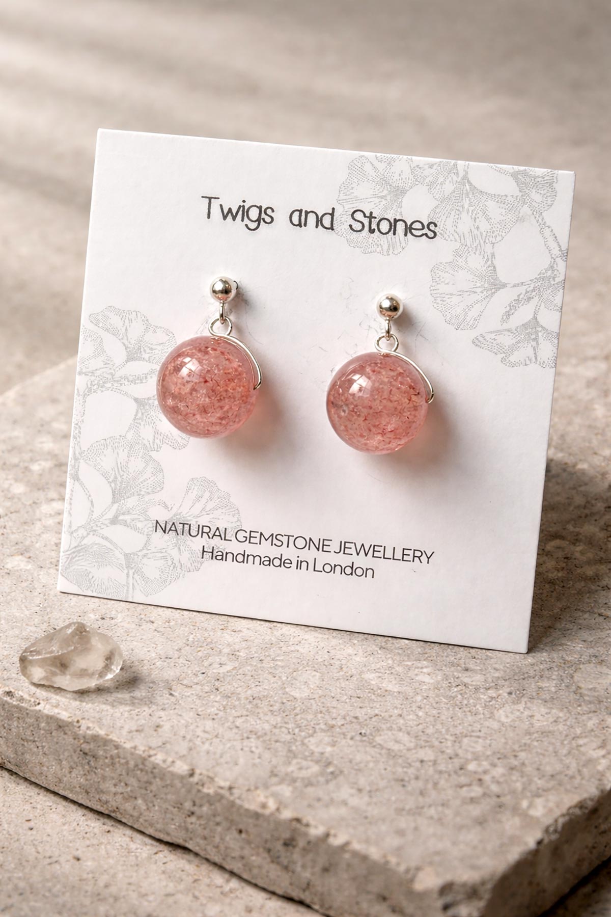 Close-up of strawberry quartz gemstone stud earrings
