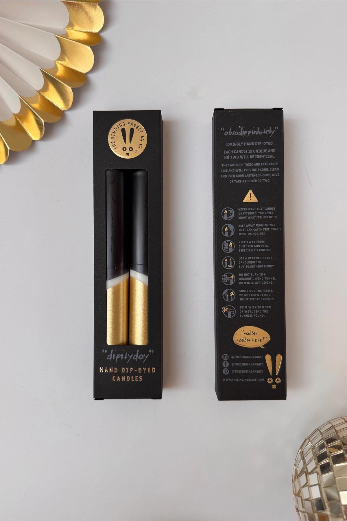 Hand dipped black and gold stearin wax dinner candles detail shot — Urban Wild