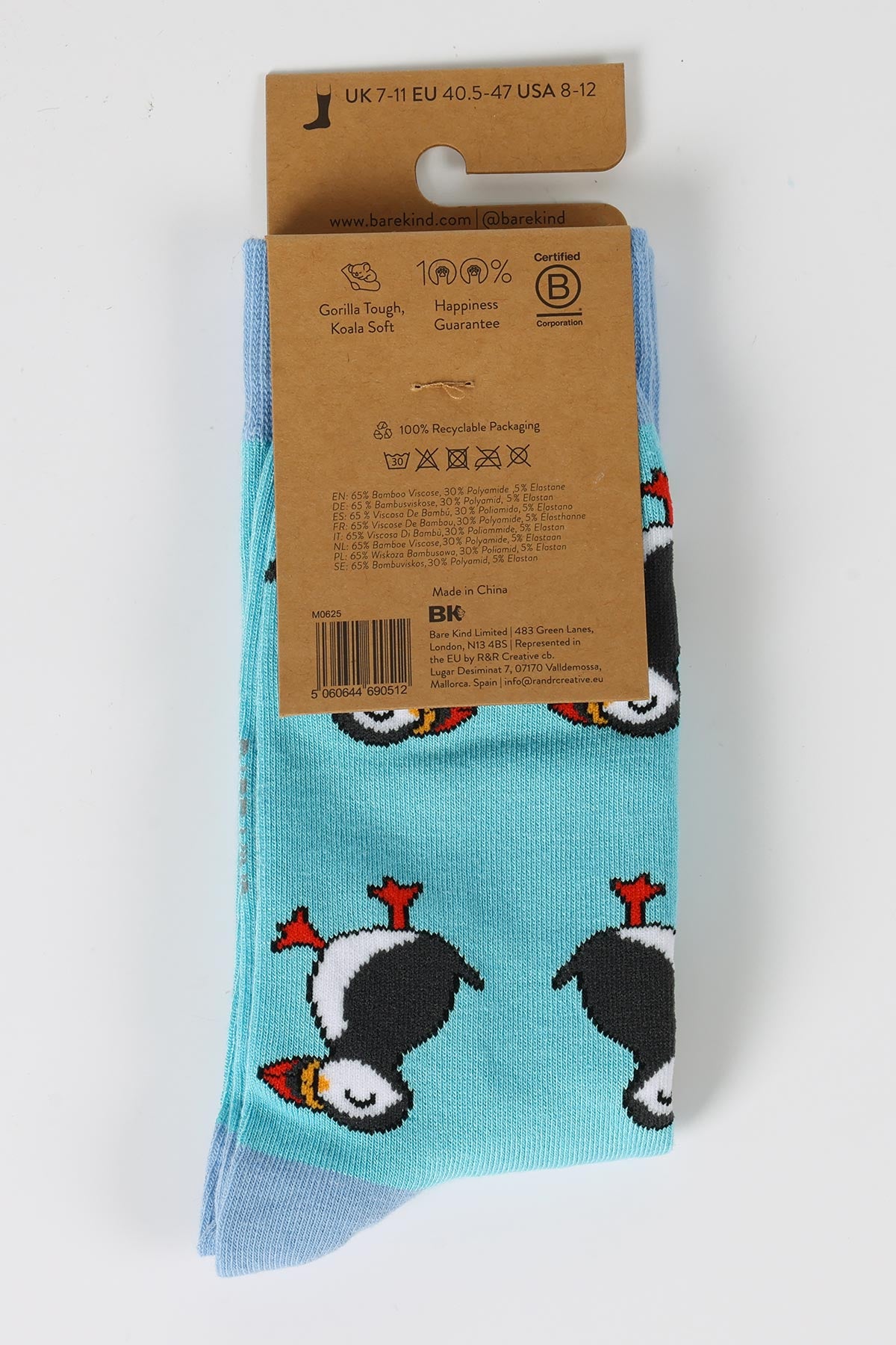 Reverse of blue bamboo puffin socks showing B Corp certification and recyclable packaging from Urban Wild
