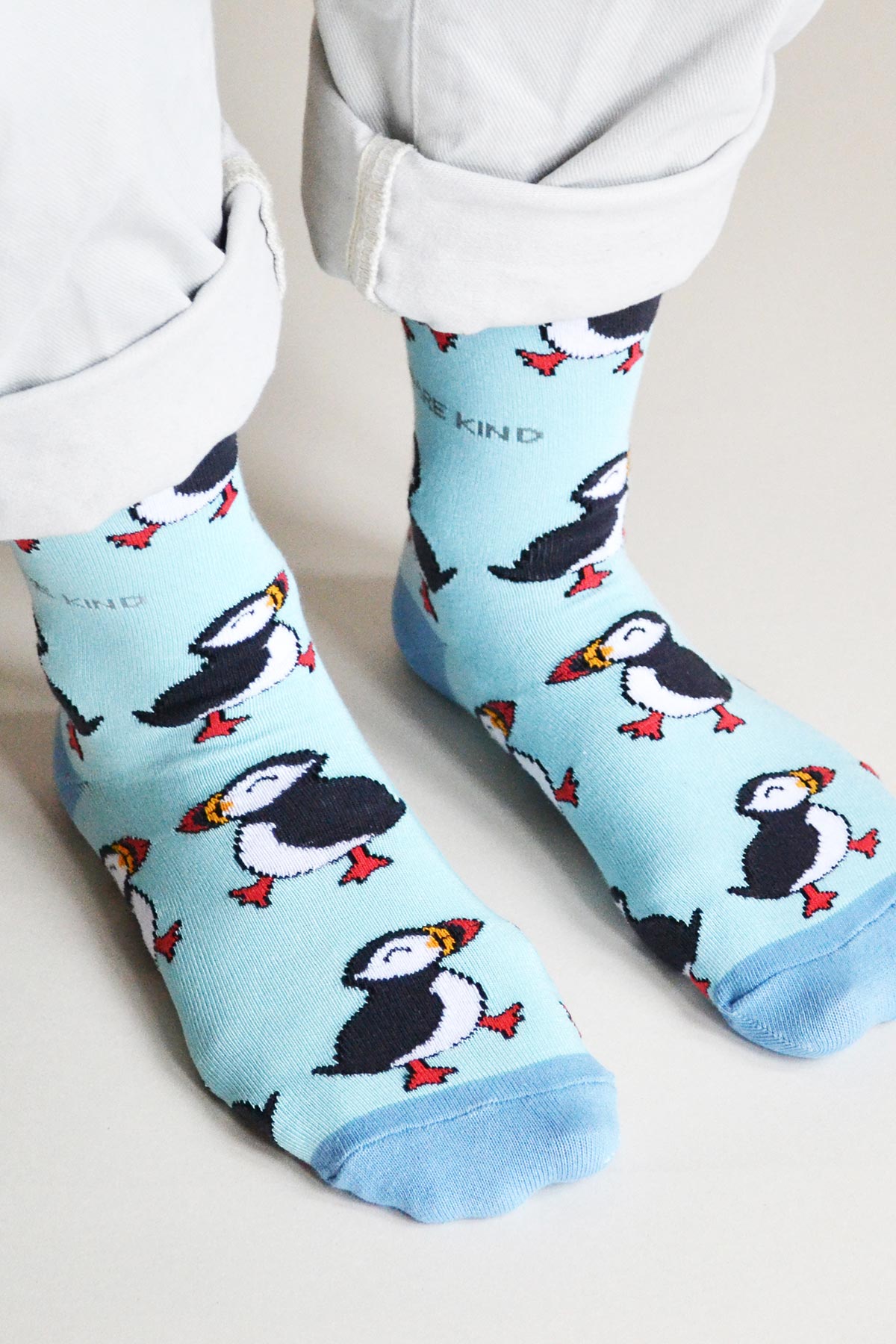 Blue puffin bamboo crew socks worn with cuffed trousers, sustainable sock gift from Urban Wild