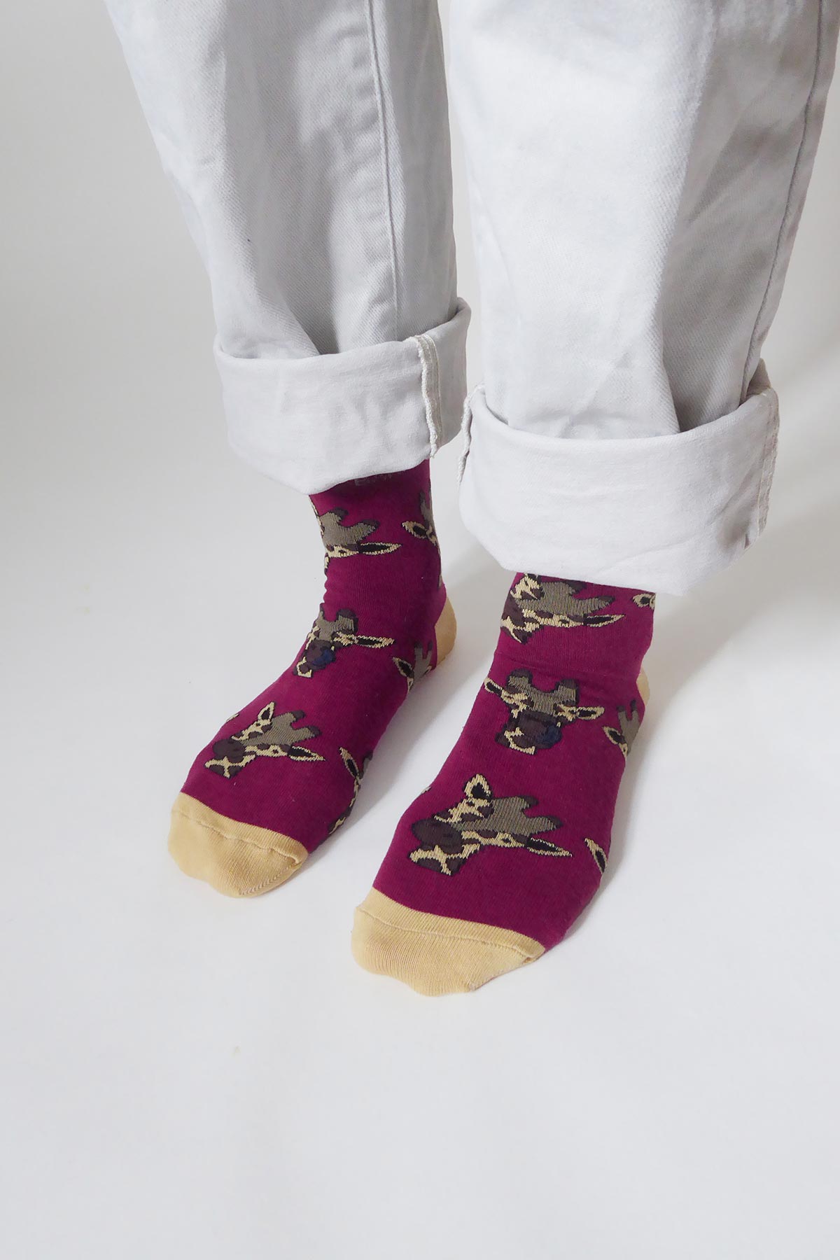 Burgundy giraffe print bamboo crew socks worn with rolled white jeans — Urban Wild