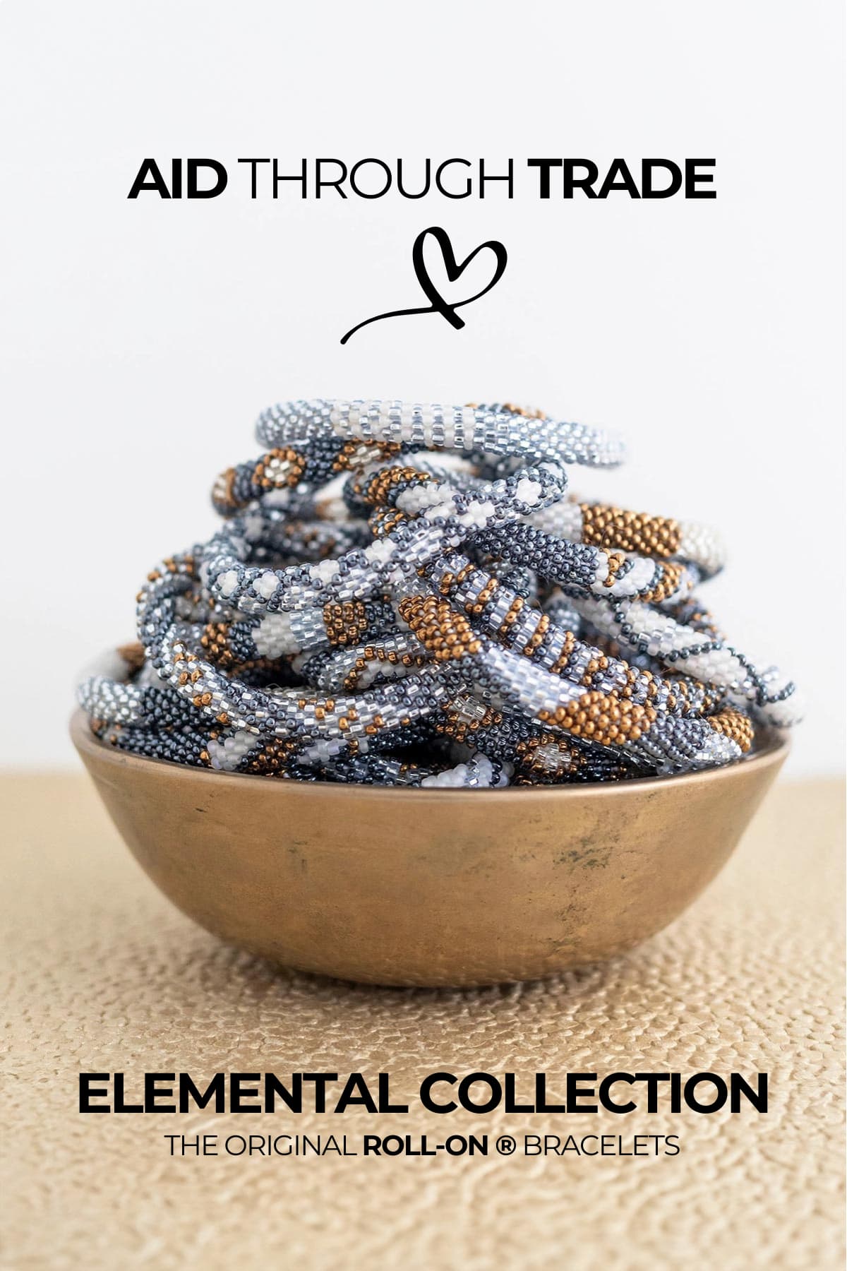 Elemental fair trade Roll-On bracelets in grey white and bronze beads in brass bowl — Urban Wild