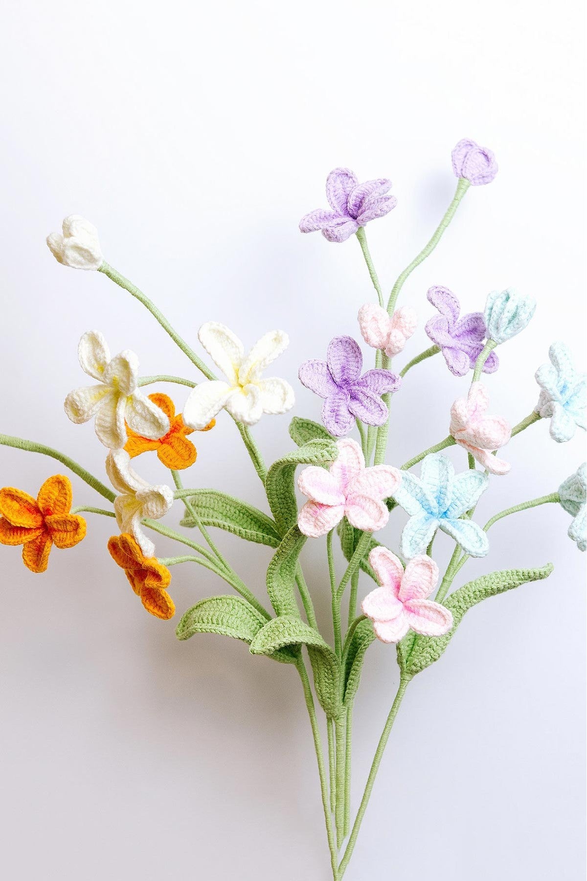 Handmade frangipani crochet flower stem in warm tropical colours, everlasting bloom — Urban Wild
