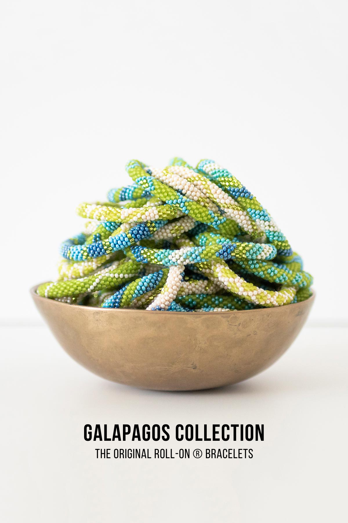 Galapagos beaded Roll-On bracelets in lime green, turquoise and ivory in brass bowl — Urban Wild