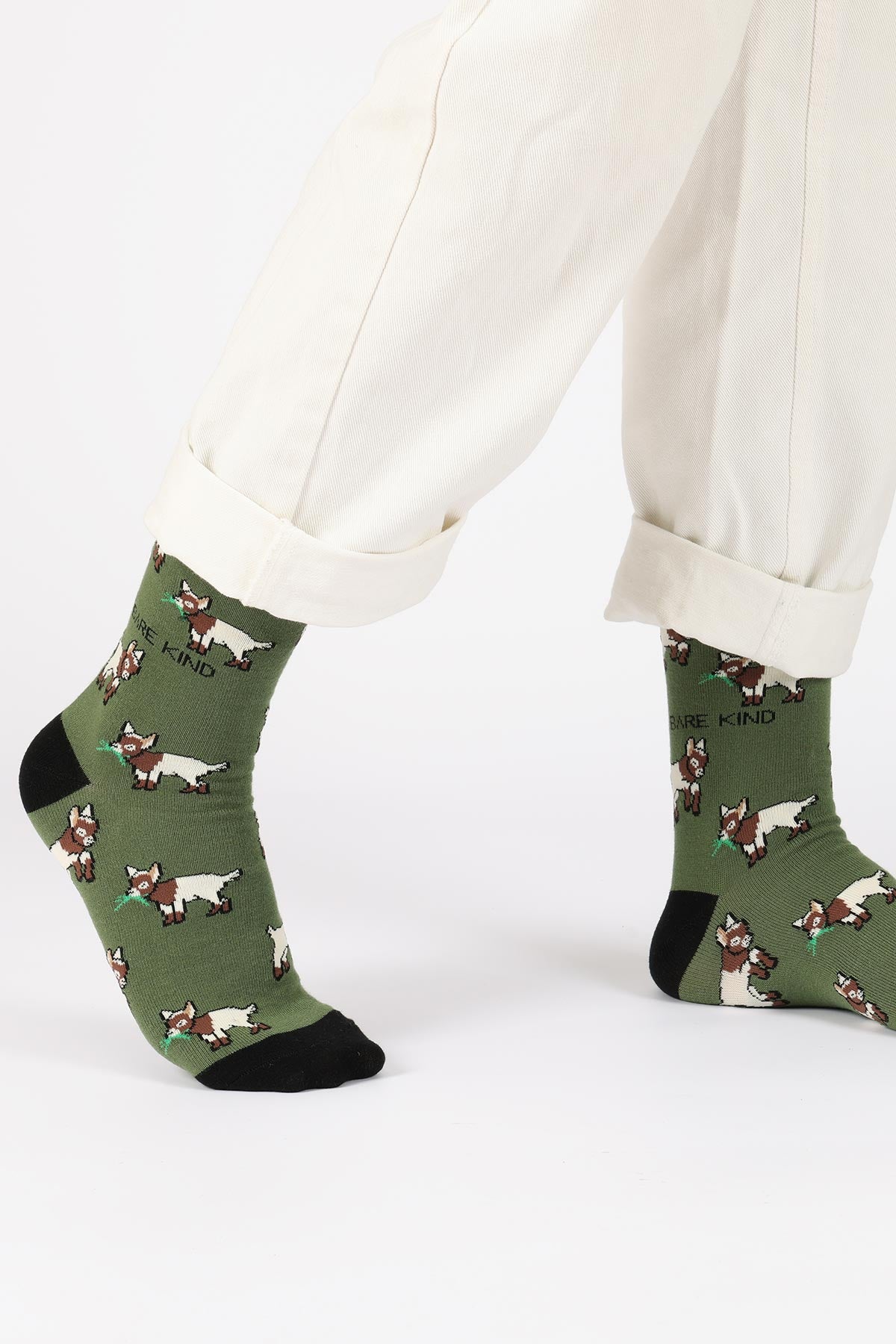 Sage green goat print bamboo crew socks worn with cream trousers — Urban Wild