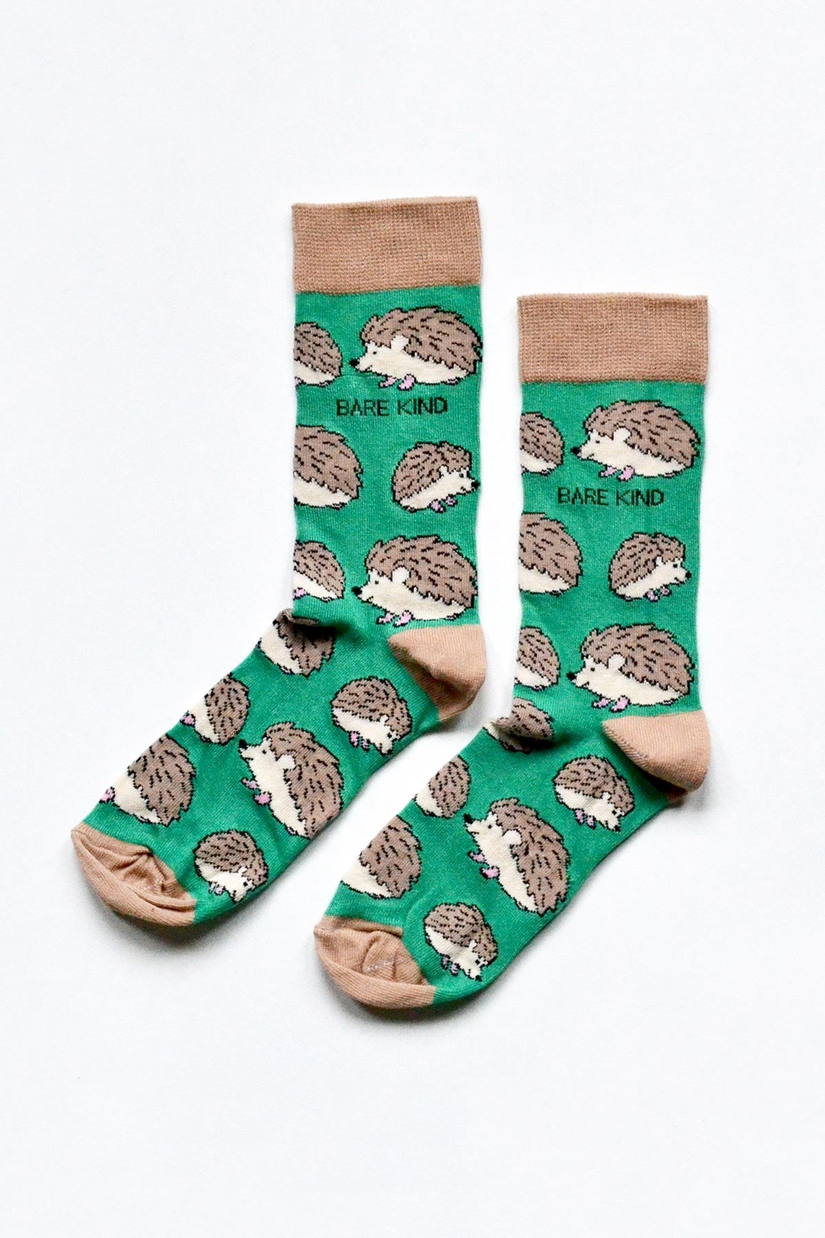 Pair of green bamboo hedgehog crew socks with beige cuff and toe — Urban Wild