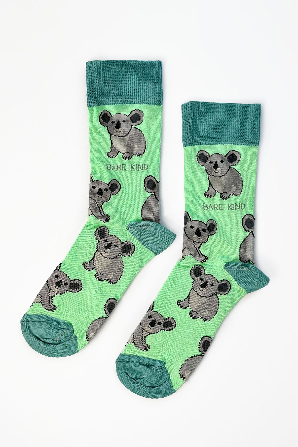 Pair of mint green bamboo crew socks with koala print and teal cuffs — Urban Wild