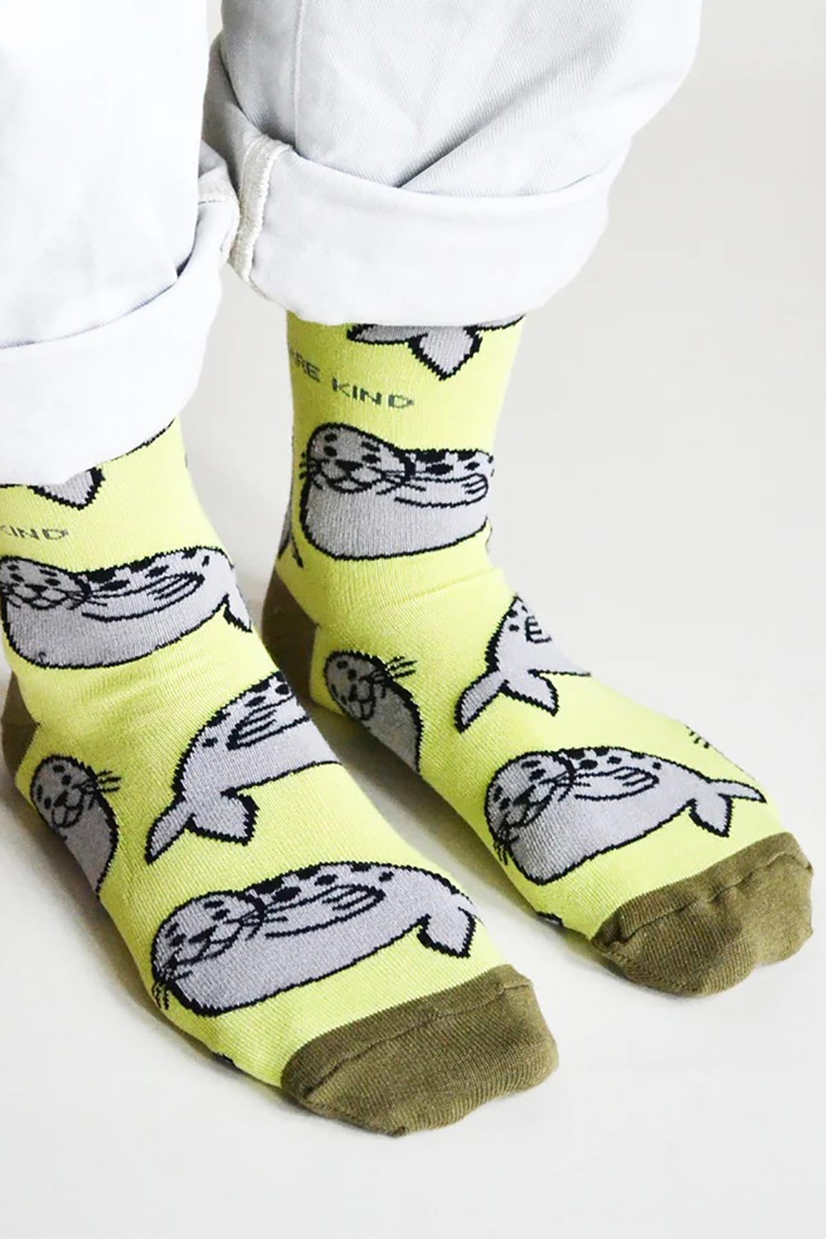Lime green bamboo socks featuring all-over seal design and olive green toe — Urban Wild