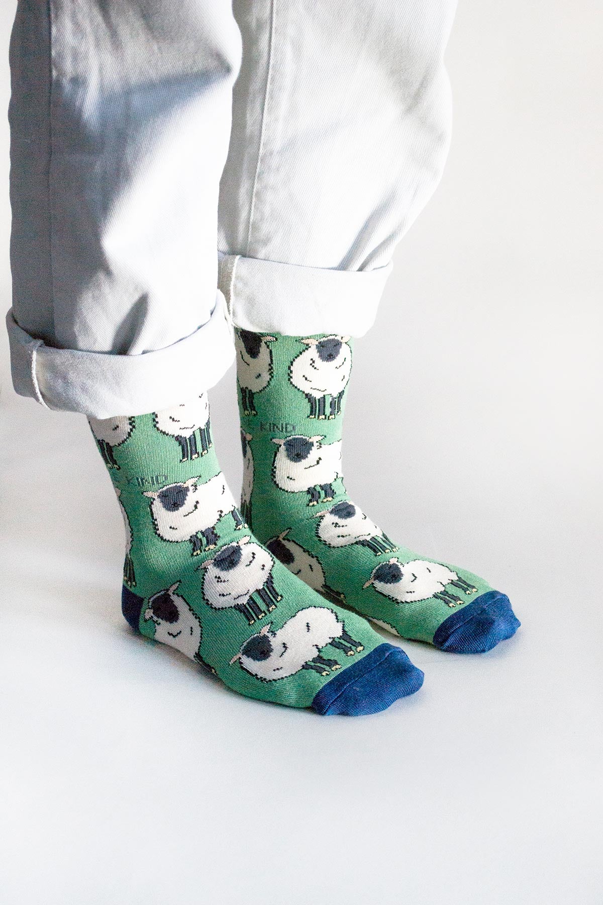 Green sheep print bamboo crew socks worn with rolled white trousers - Urban Wild