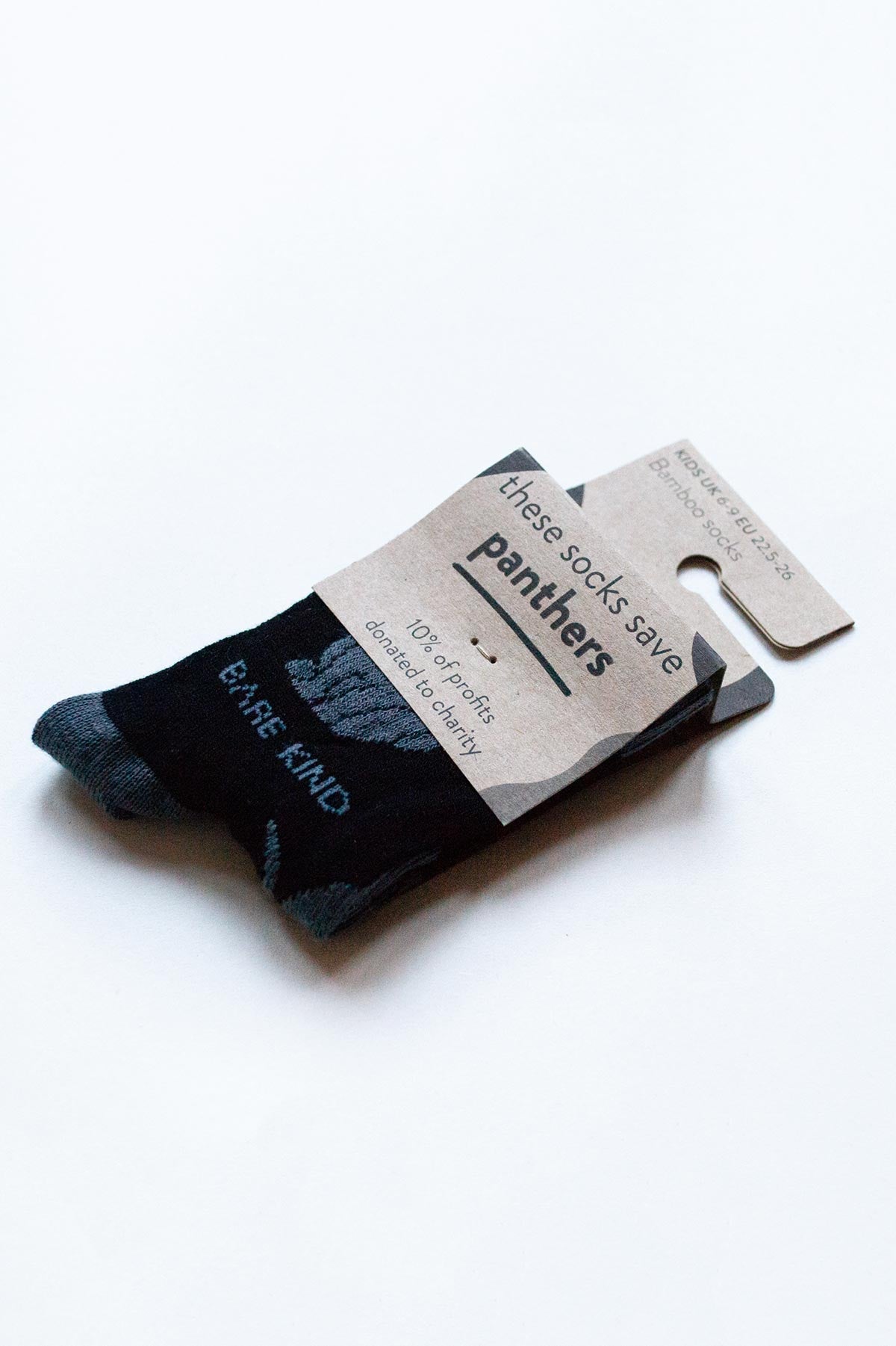 Side view of Bare Kind kids panther bamboo socks in eco-friendly packaging — Urban Wild