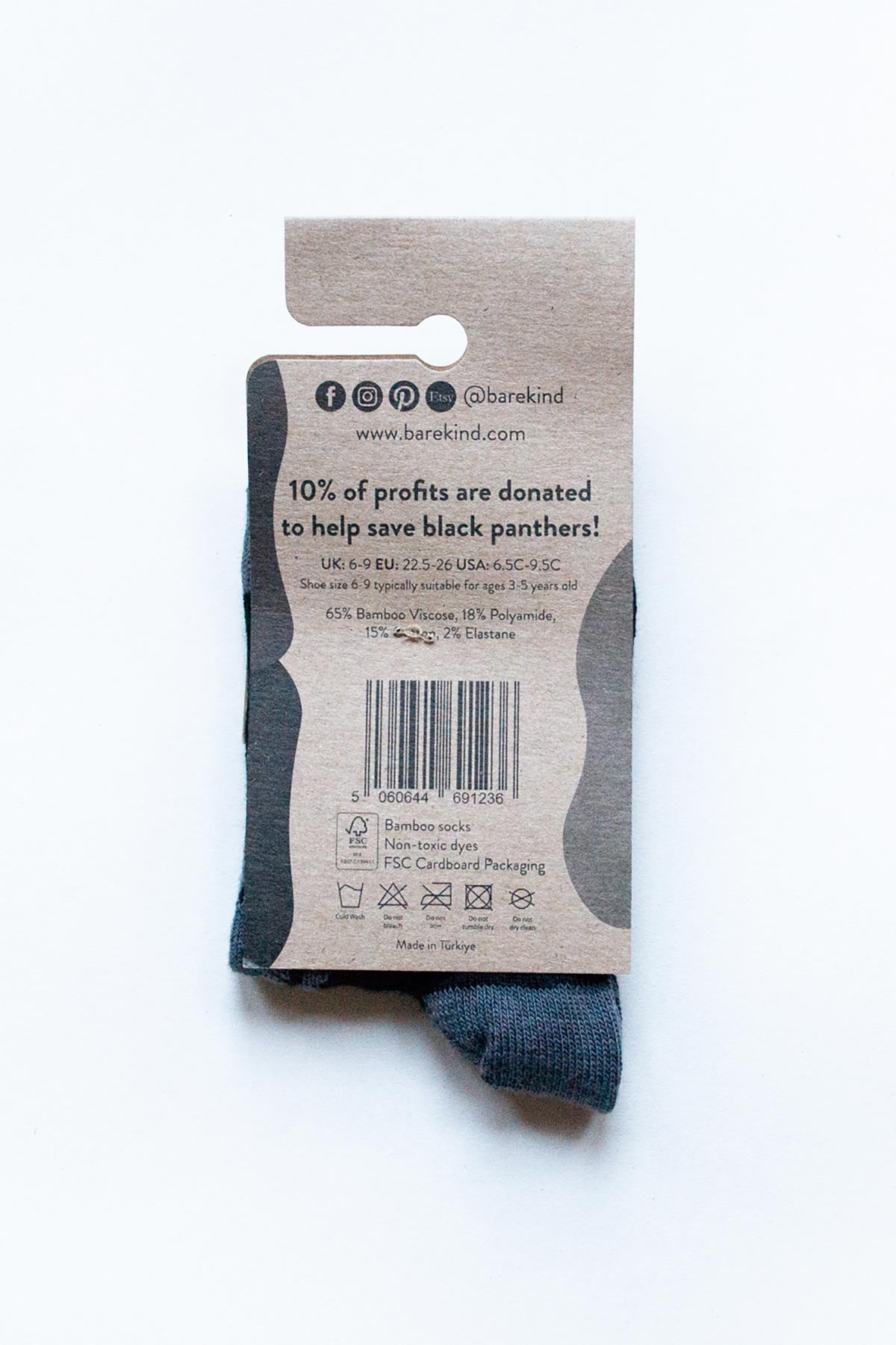 Back of packaging showing bamboo composition and wildlife charity donation details — Urban Wild