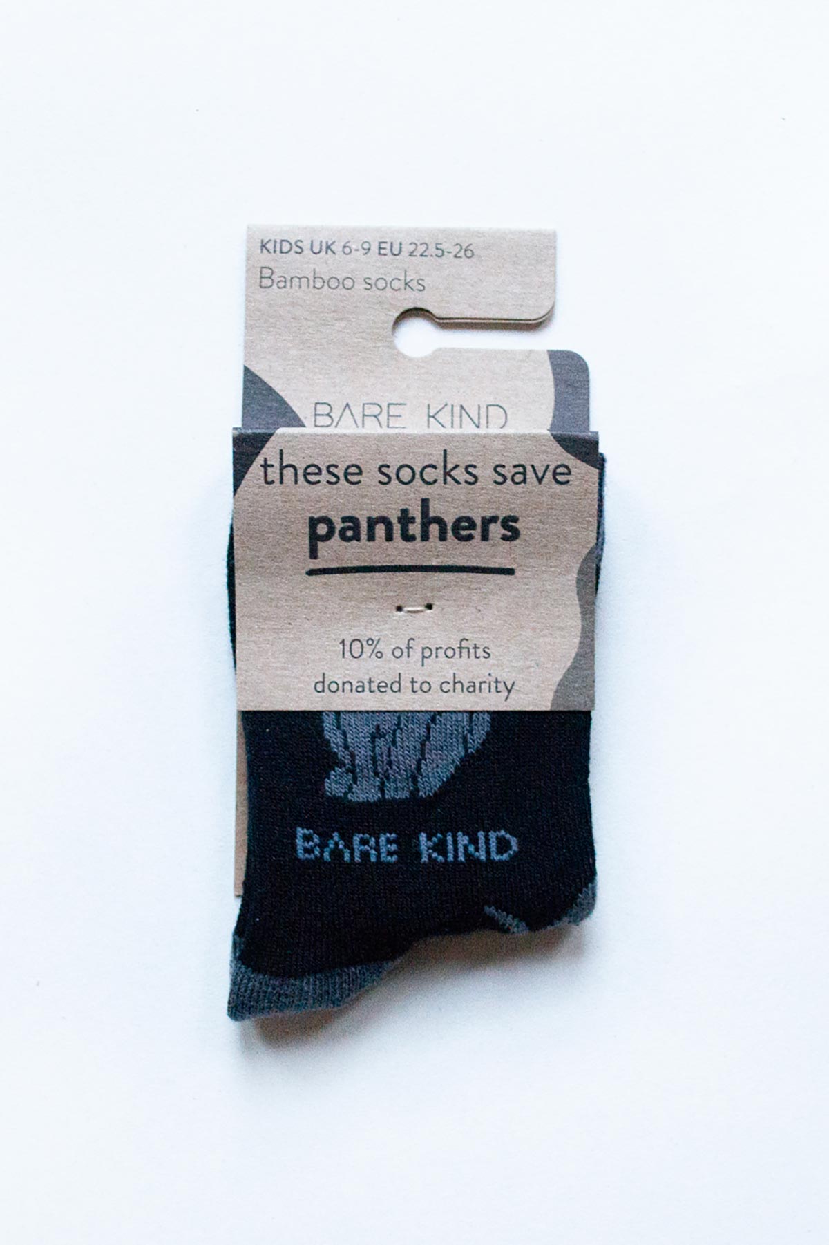 Kids black panther bamboo socks by Bare Kind in plastic-free cardboard packaging — Urban Wild
