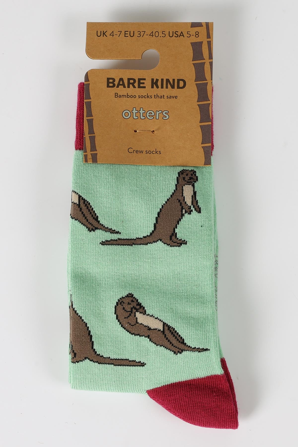 Mint green bamboo otter crew socks by Bare Kind in recyclable card packaging — Urban Wild