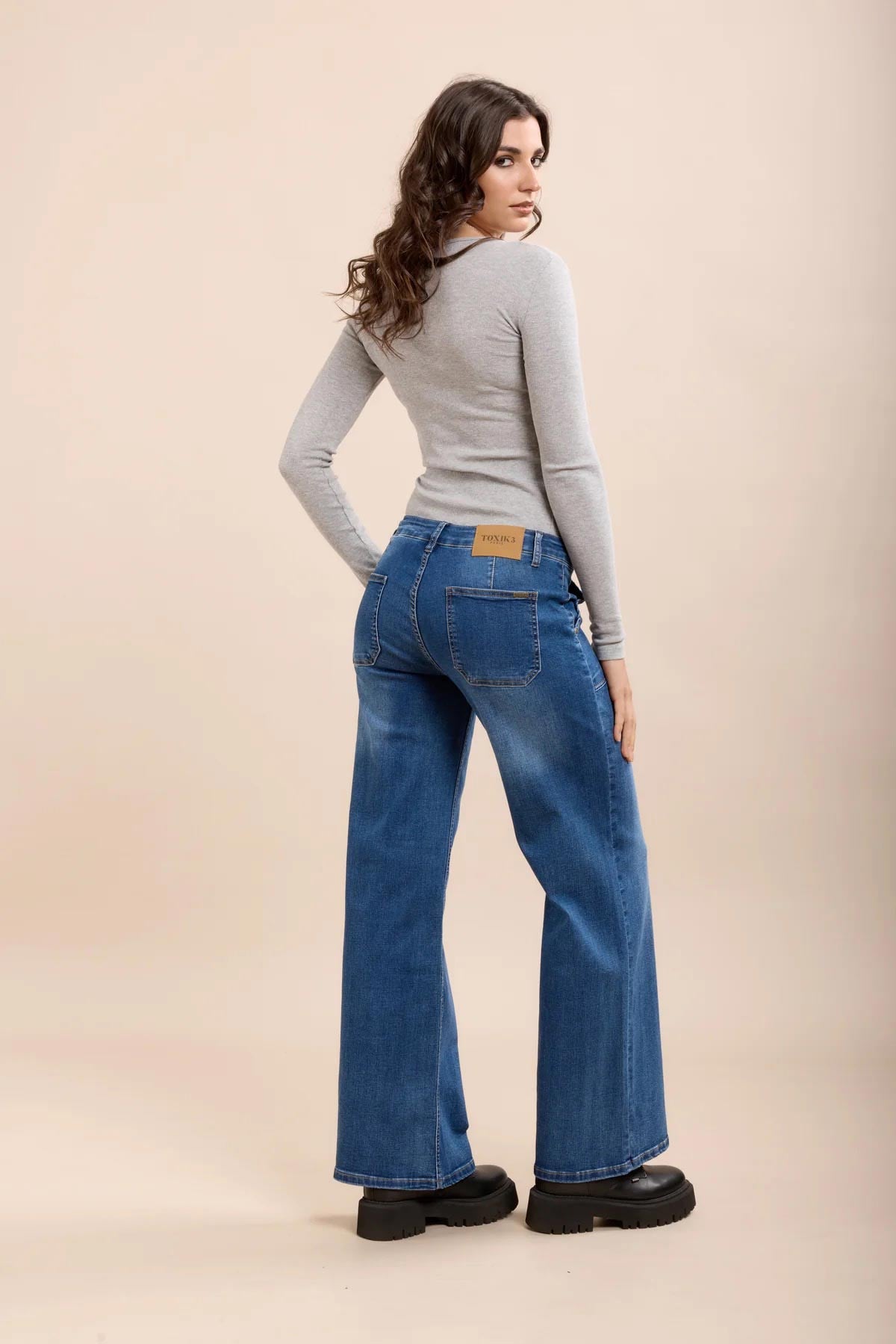 Mid Wash Blue High-Waisted Wide Leg Jeans styled back