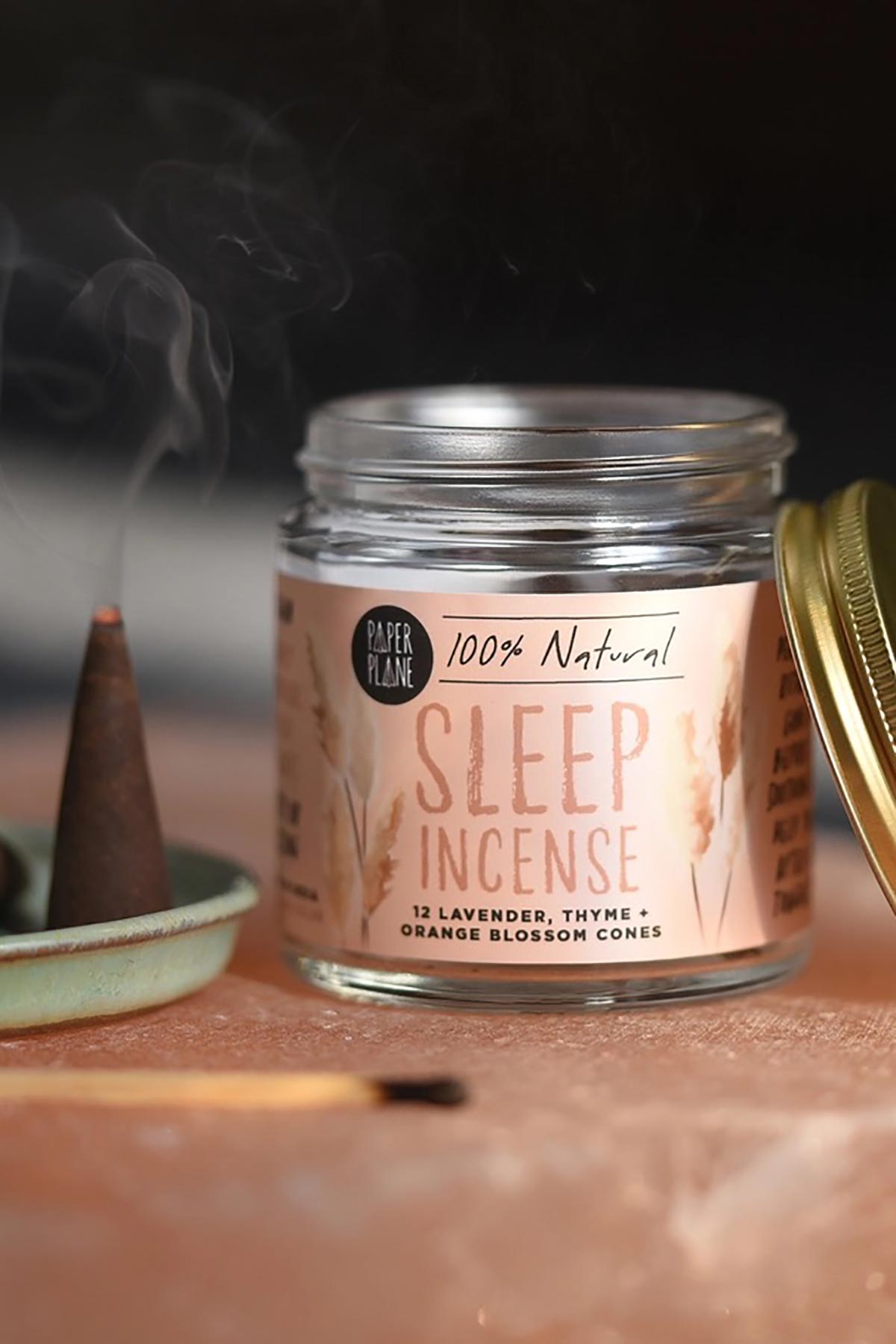 Lavender thyme incense cone burning beside glass jar — Urban Wild
