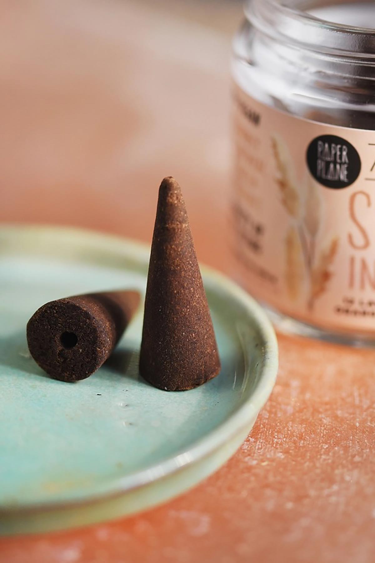 Close up of natural plant-based sleep incense cones on dish — Urban Wild