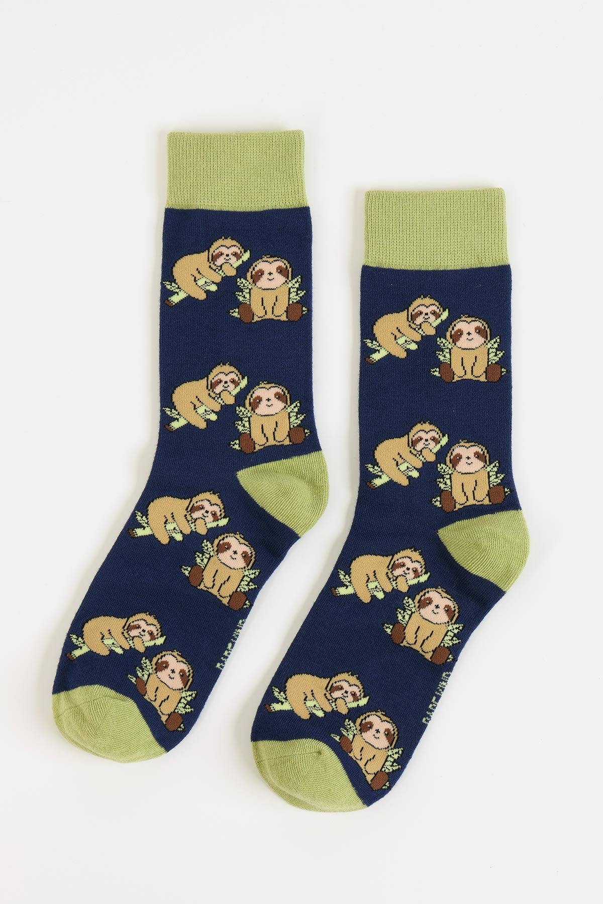 Navy bamboo sloth crew socks with green heel and toe flat lay — Urban Wild
