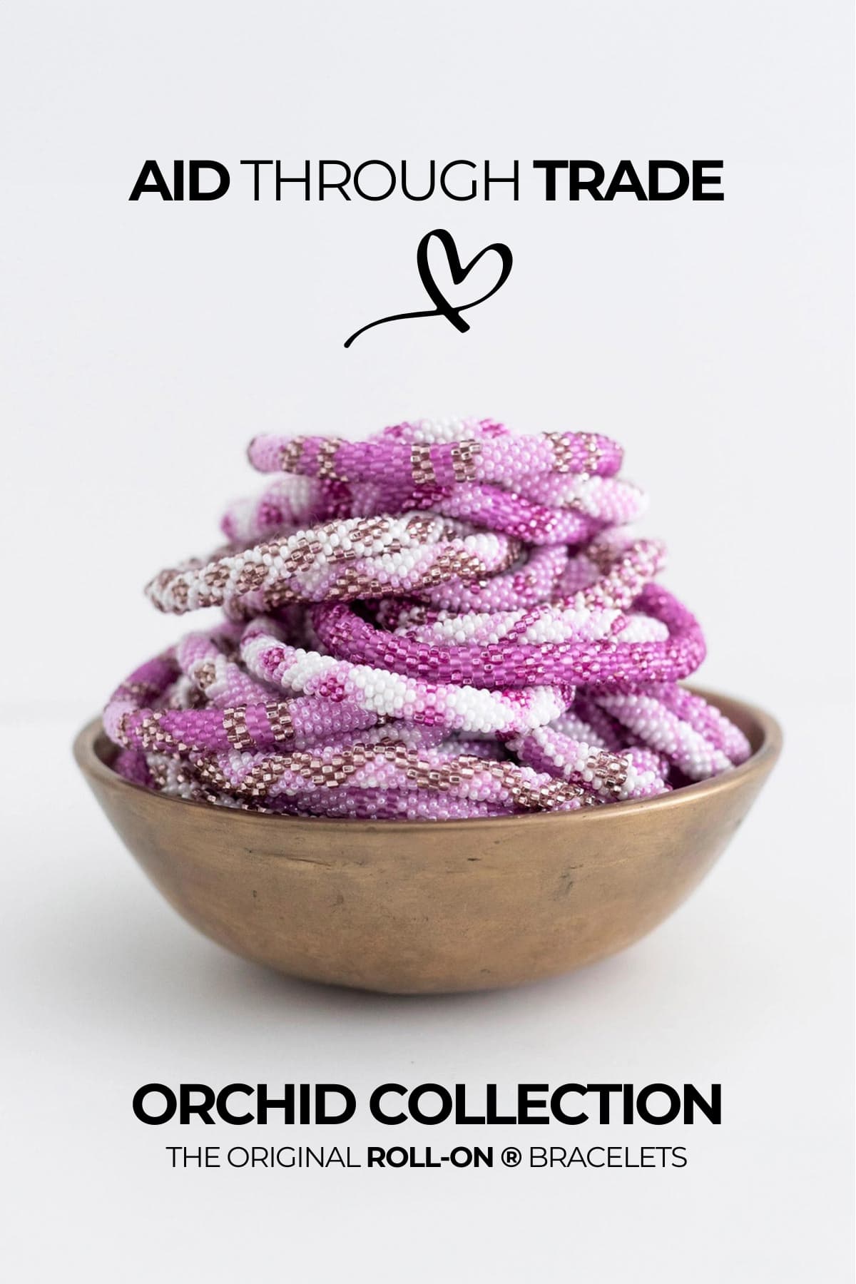 Orchid pink beaded fair trade Roll-On bracelets stacked in brass bowl handmade Nepal Urban Wild
