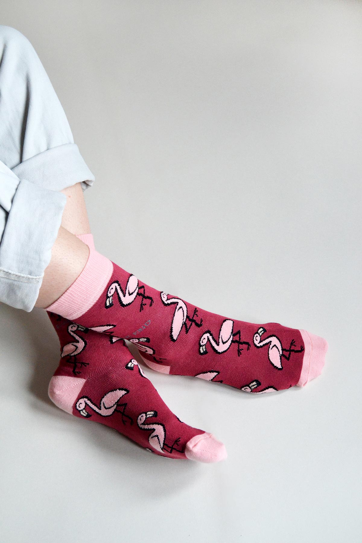 Pink flamingo bamboo crew socks worn with rolled denim, raspberry pink with soft pink cuffs — Urban Wild